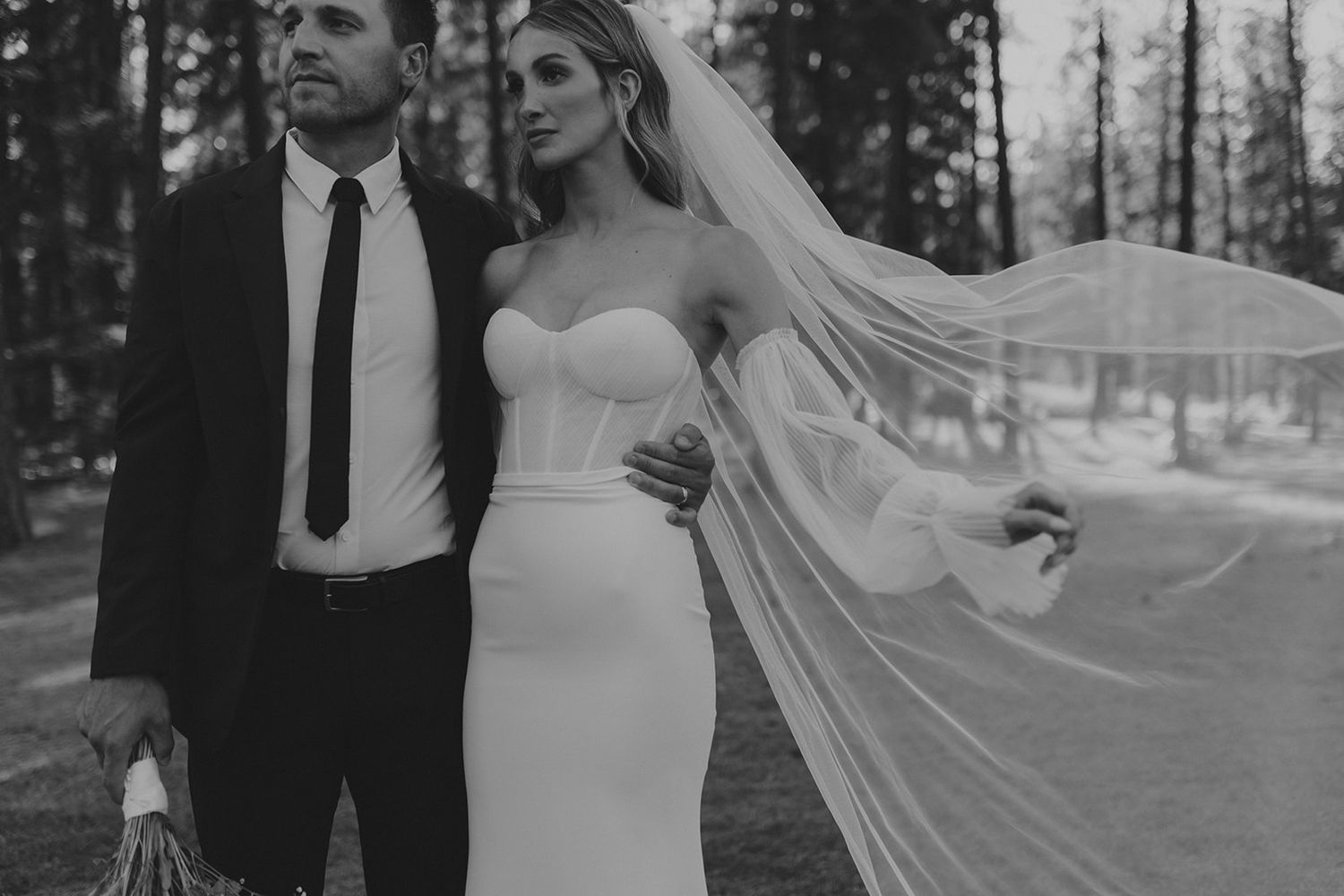 A black and white wedding photo collage showing romantic moments between newlyweds in an outdoor forest setting.