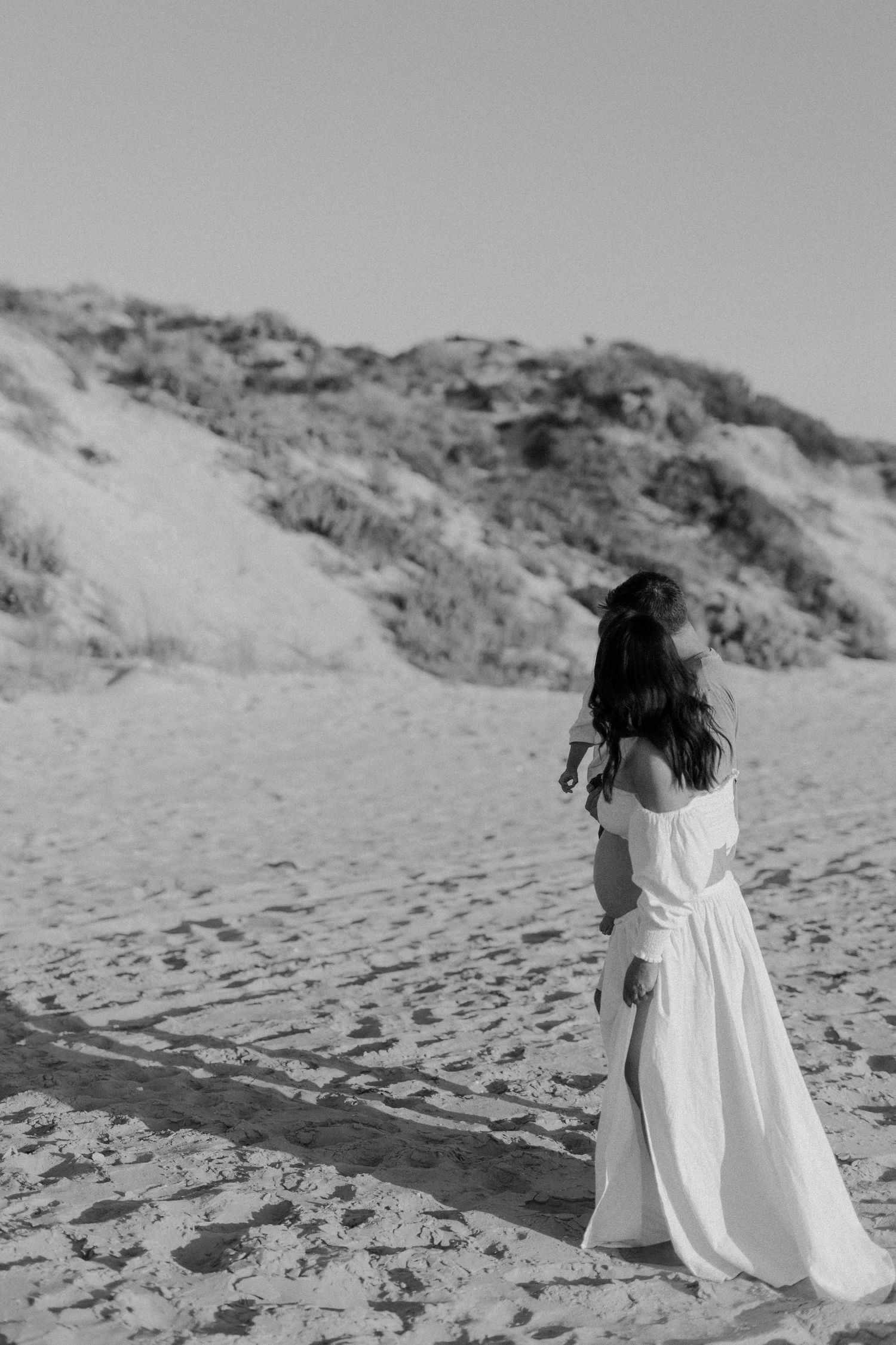 Beautiful family and expecting mother captured during a beach sunset session in Bunbury, Western Australia.