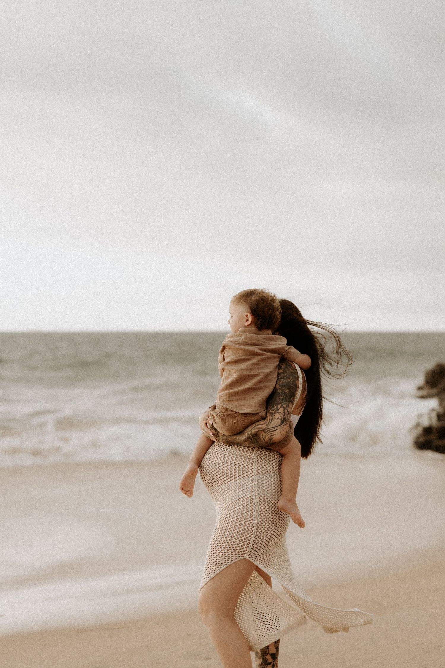 Pregnant mother with her son during a beach sunset maternity session in Bunbury, Western Australia.