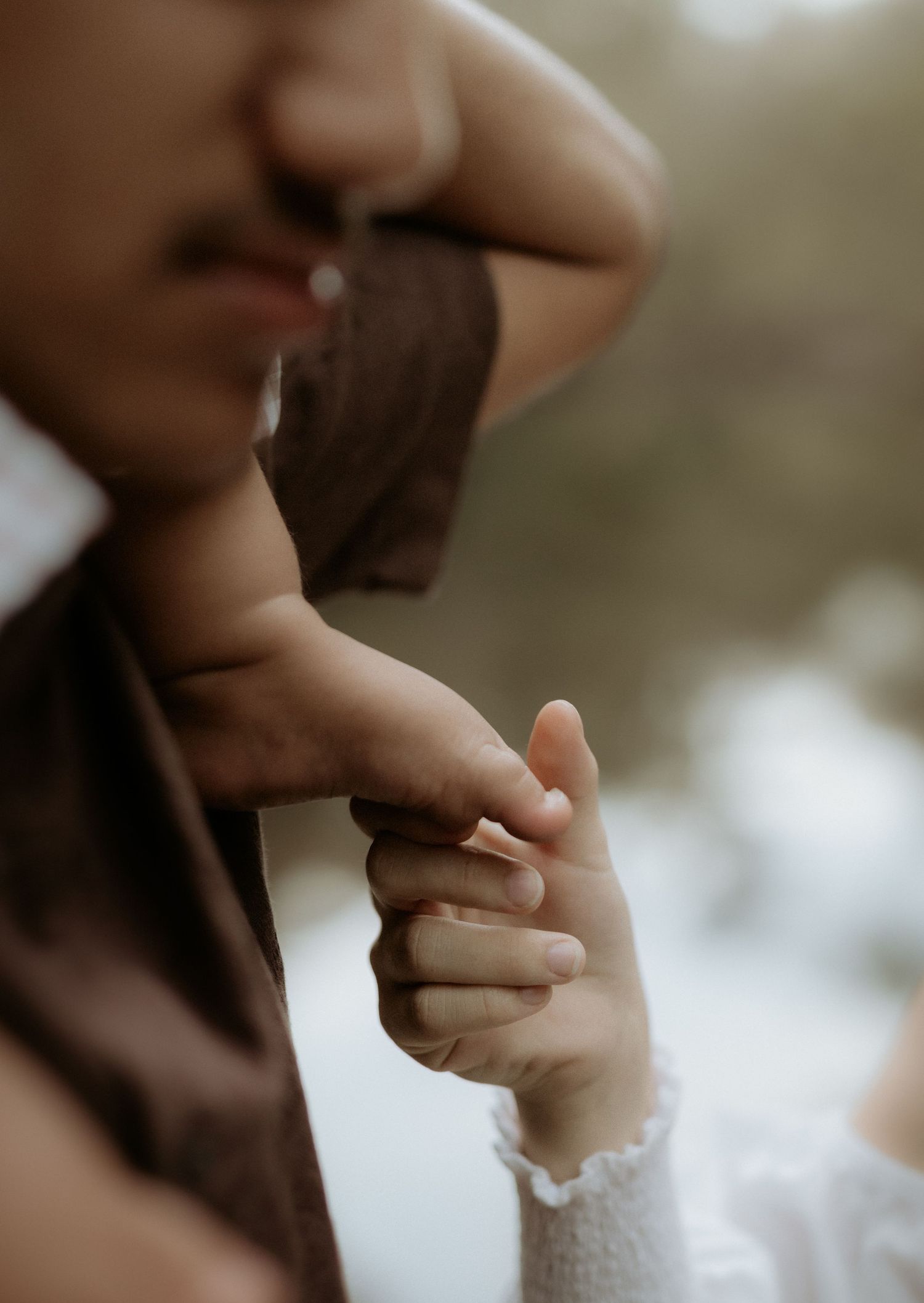 Capturing tiny details during a family and maternity session at Honeymoon Pool in Western Australia.
