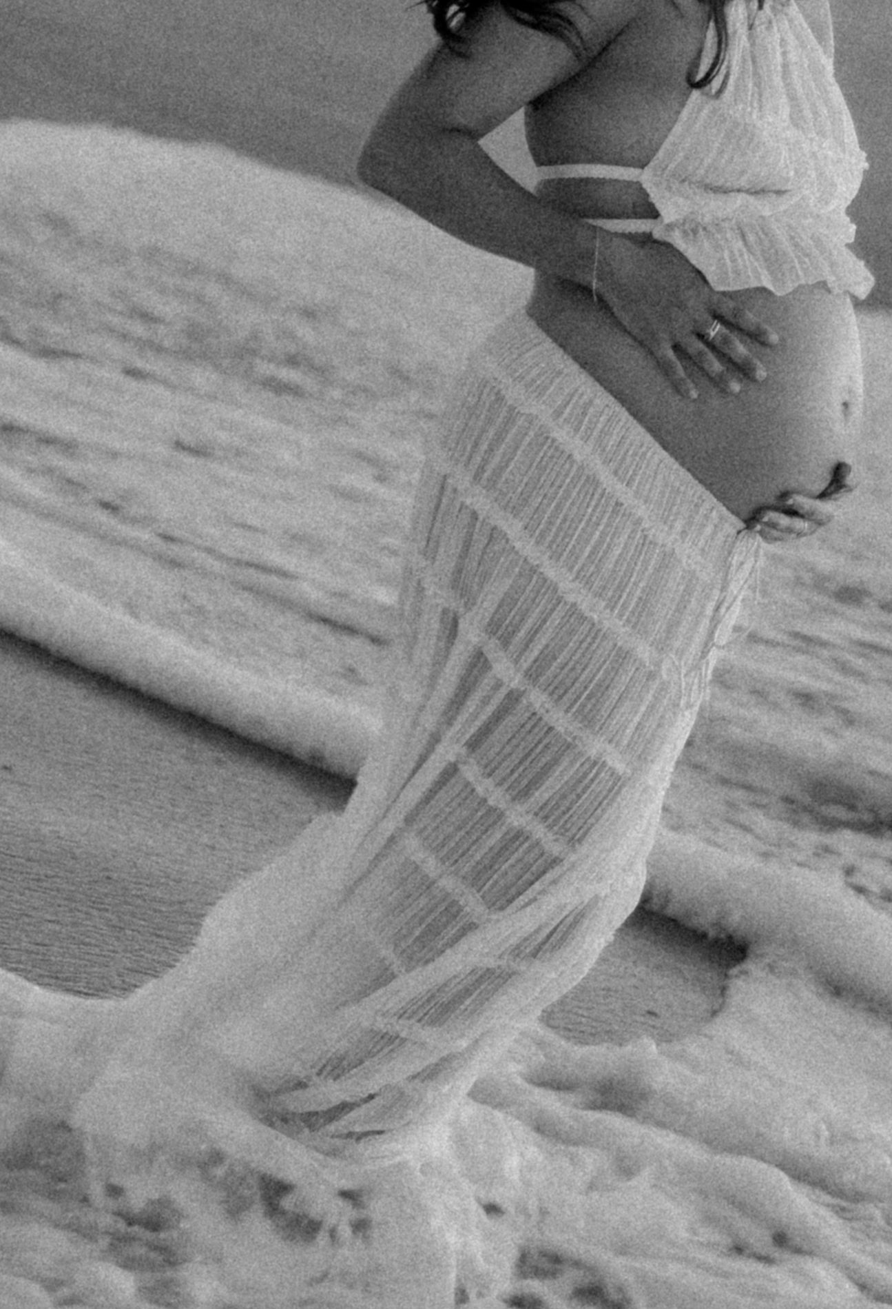 Pregnant mother during a beach sunset maternity session in Bunbury, Western Australia.