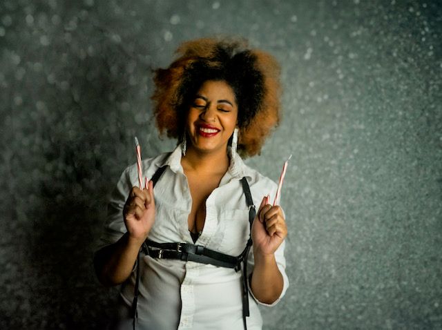 Boudoir self portrait in Jacksonville NC by Hinton Imagery playful and silly holding candy canes up like a pew pew