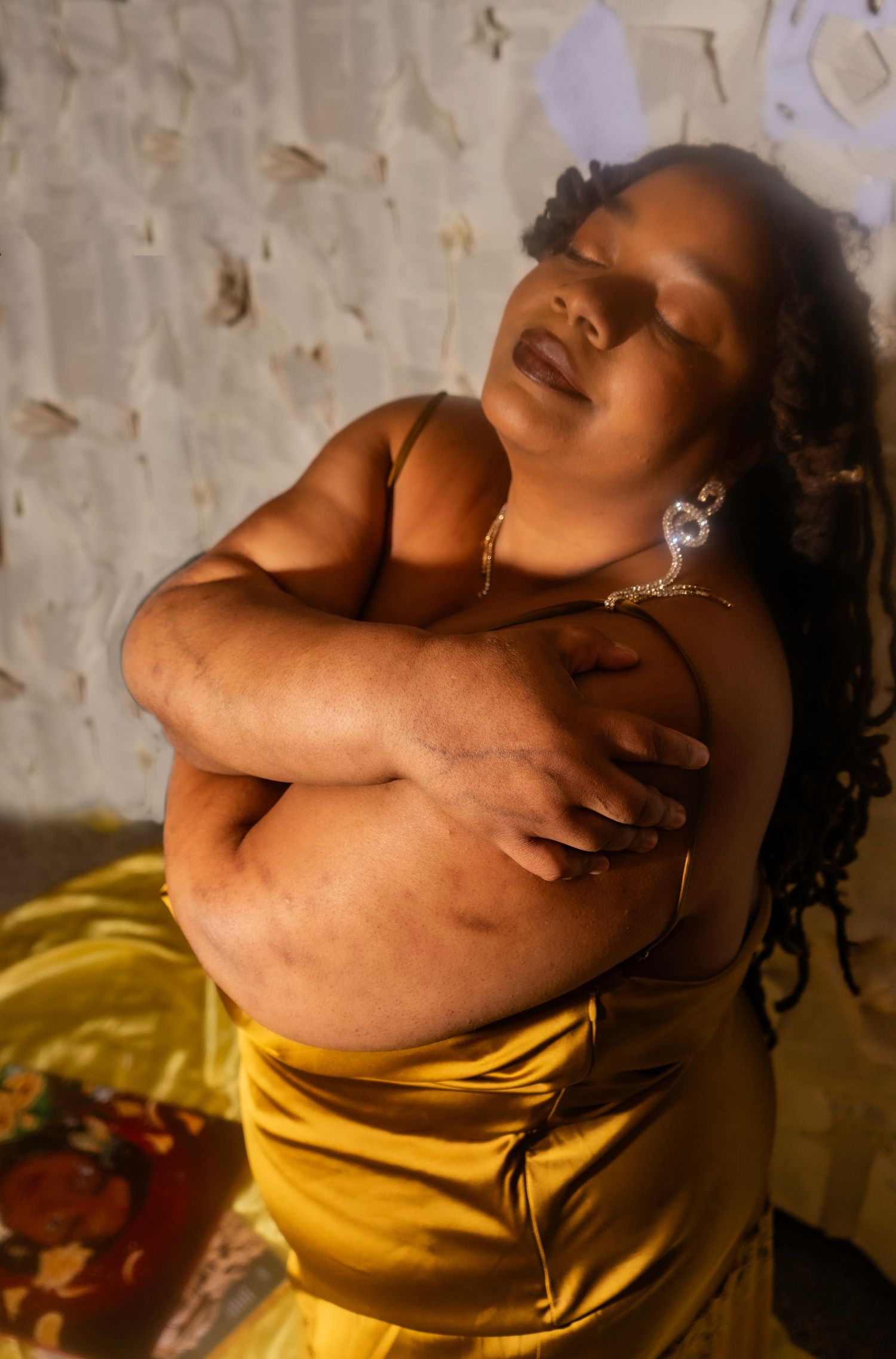 Intimate Empowering portrait session with Plus size Black woman with locs hugging themselves in Jacksonville NC by Hinton Imagery