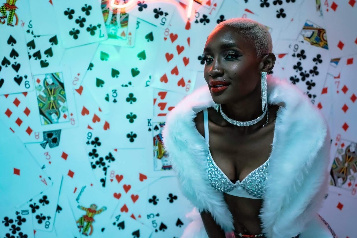 Beautiful Buzz cut on a Black woman with sparkly earrings & a necklace in a Burlesque inspired Boudoir Photo session by Hinton Imagery
