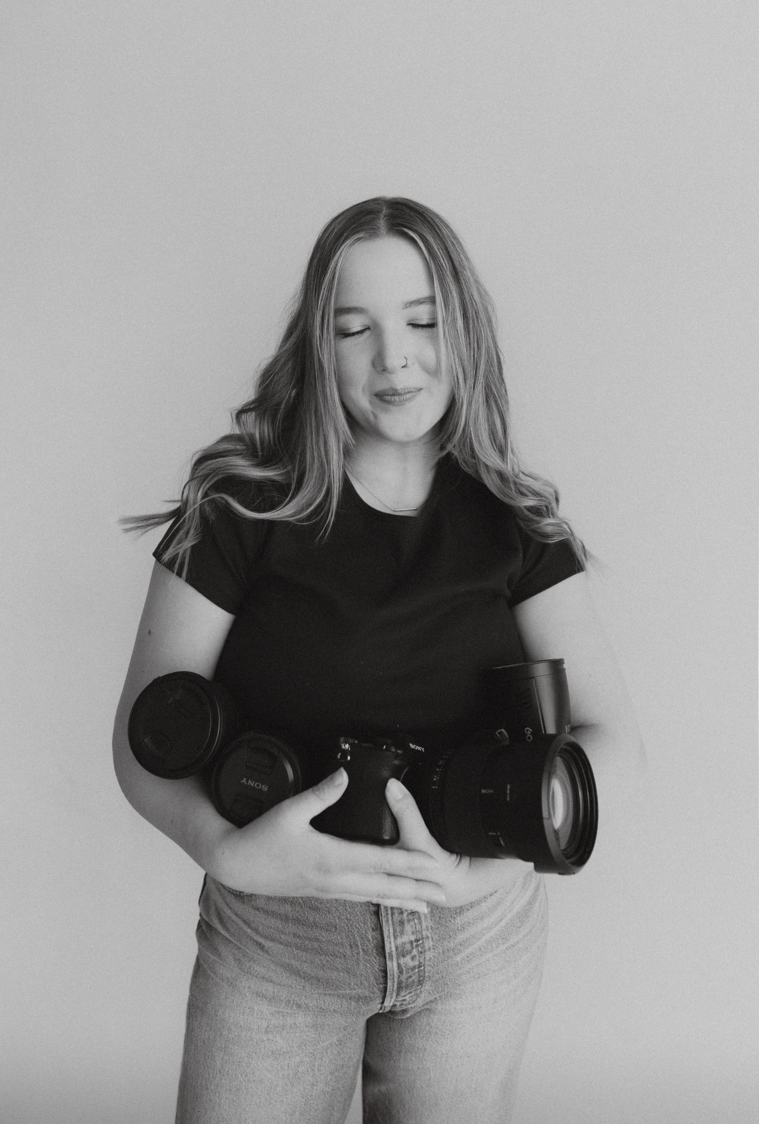 Series of black and white portraits showing playful poses with camera.