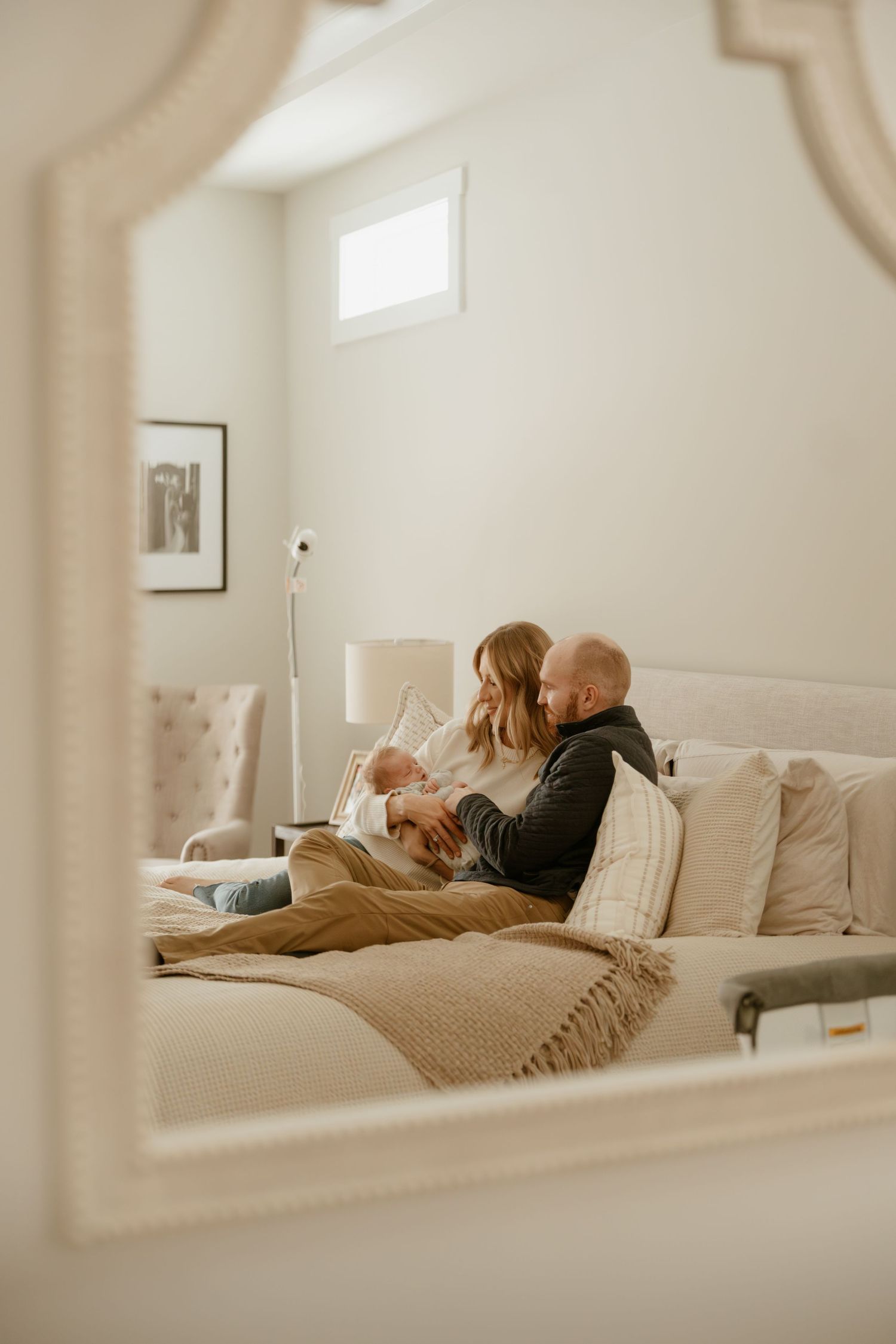 Cozy lifestyle photos in bright minimal bedroom with natural light.