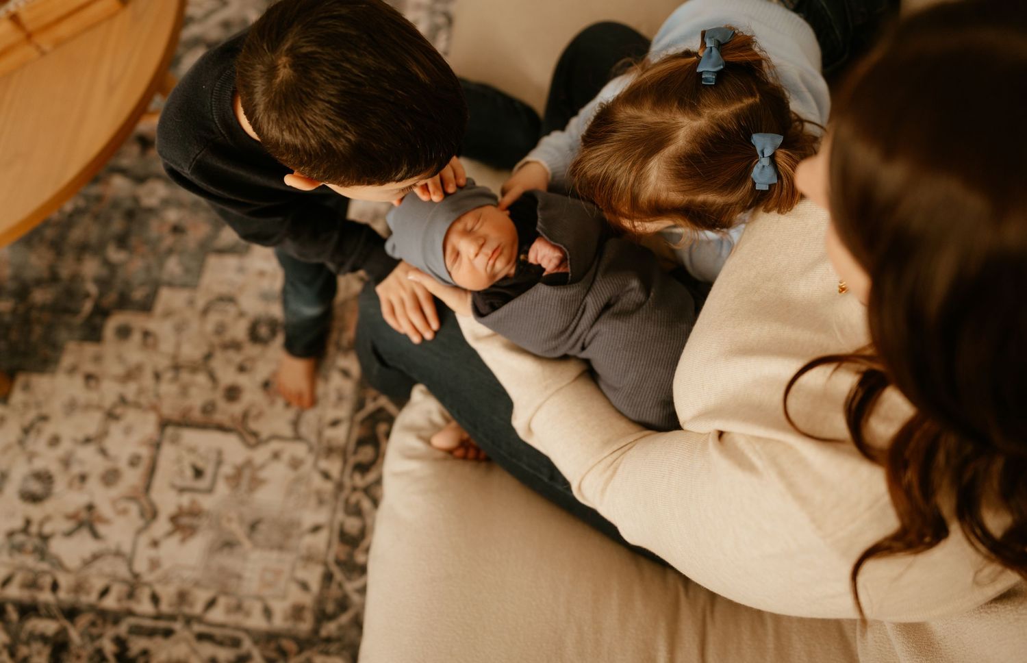 Intimate lifestyle photography session with a couple relaxing on a couch at home.