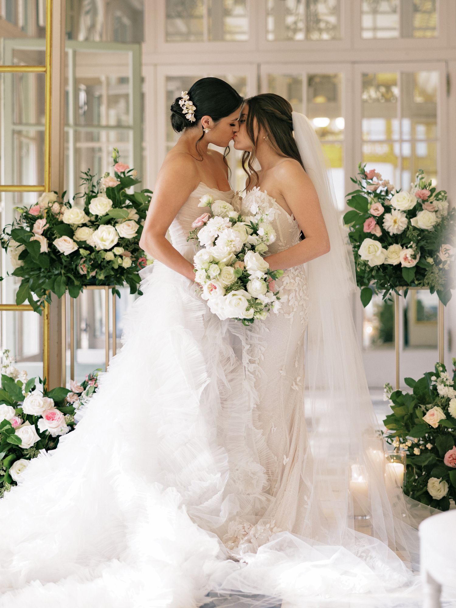 Color portrait of a lesbian couple kissing at the altar during their wedding at Larz Anderson House, Washington, DC