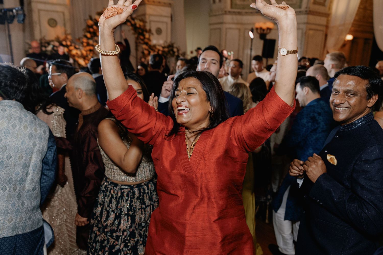 Auntie dancing at a South Asian Indian wedding reception at the Chicago Cultural Center