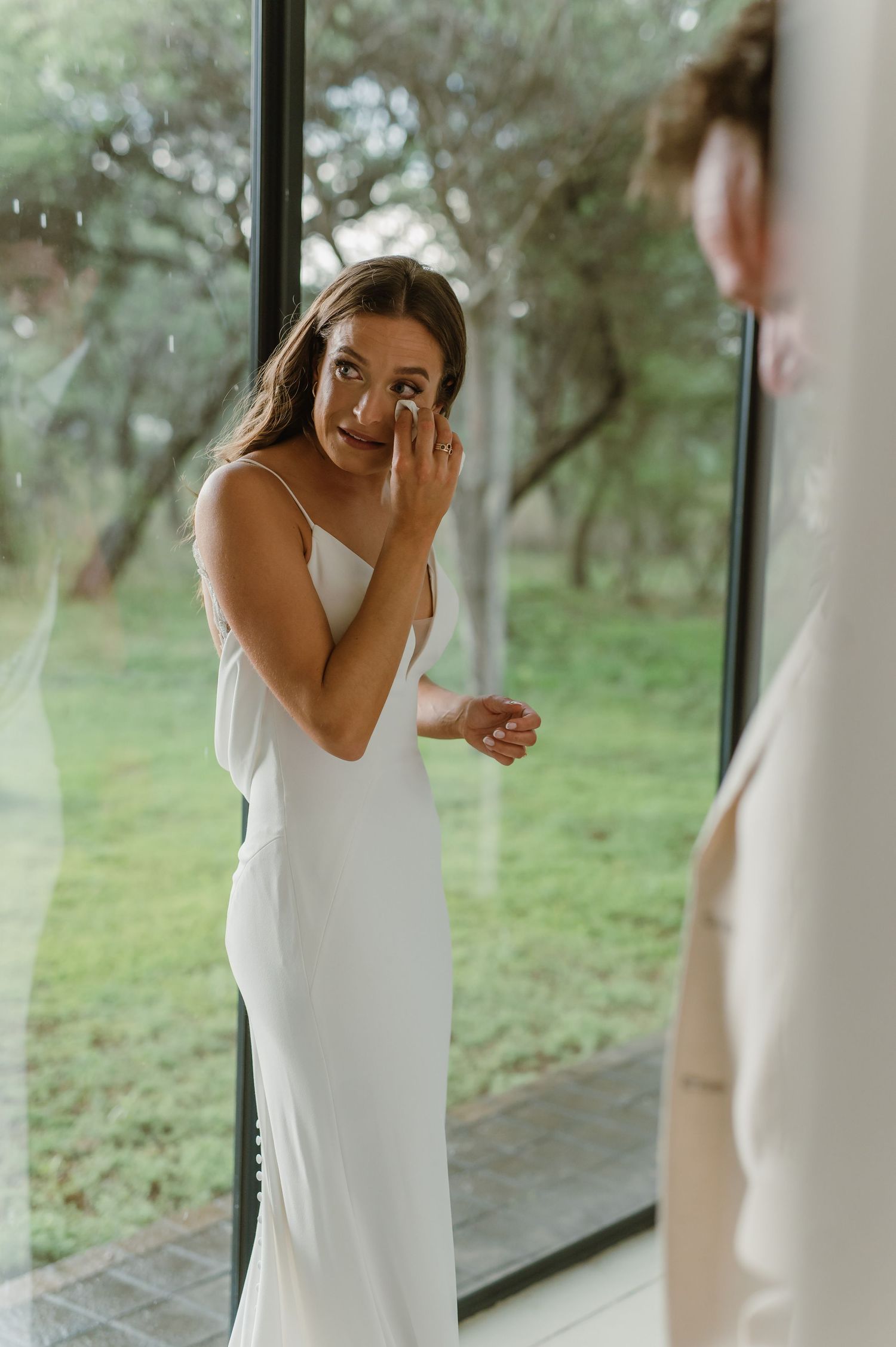 Emotional first look sequence showing joyful reactions in a bright indoor setting.
