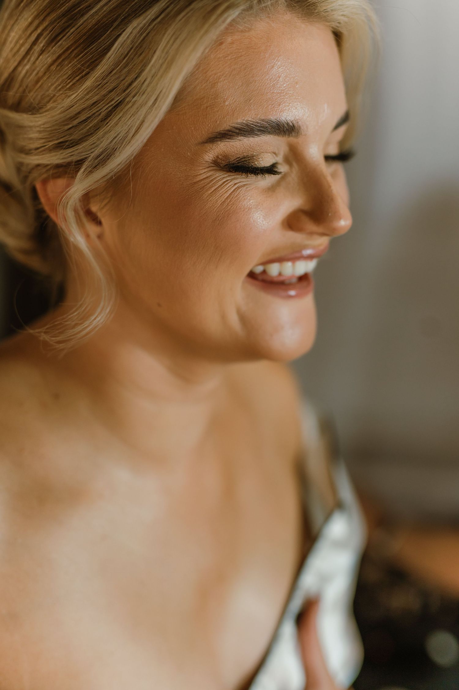 Close-up profile shots showing joyful expressions and natural makeup.