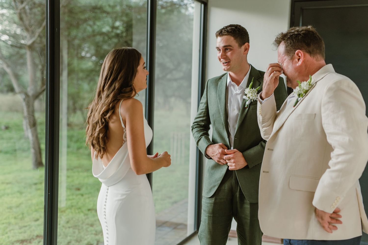 Wedding first look sequence showing reactions and emotions in a modern space.