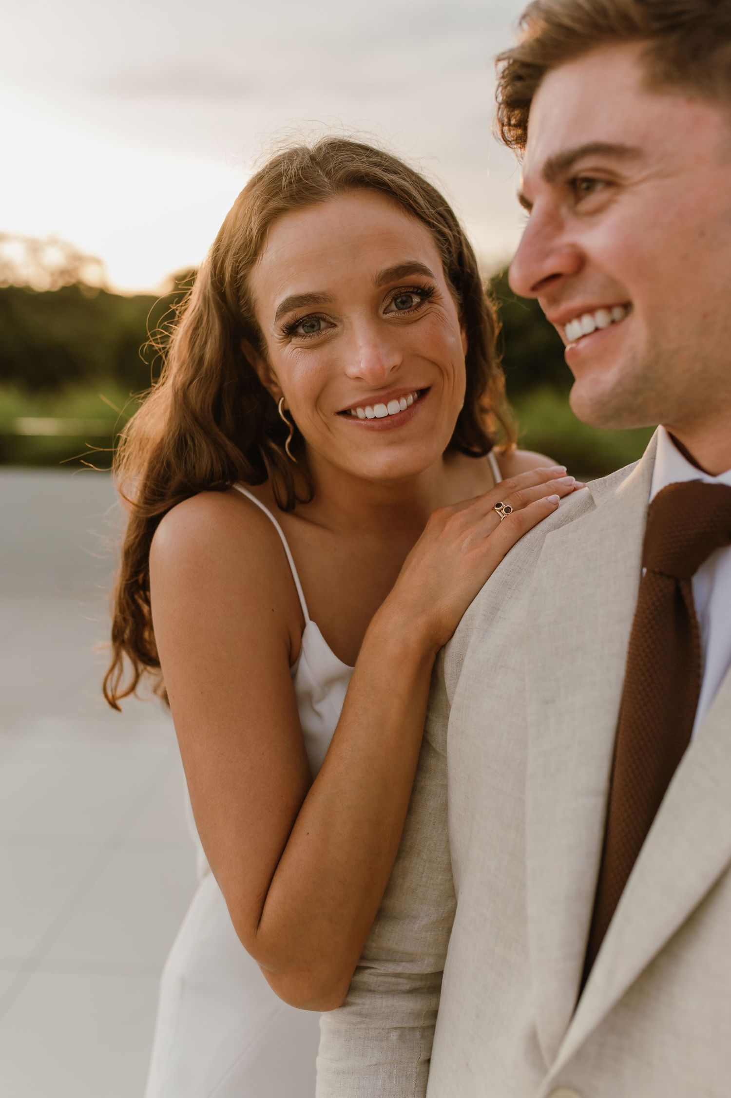 A close-up portrait of a couple sharing an intimate moment in wedding attire.