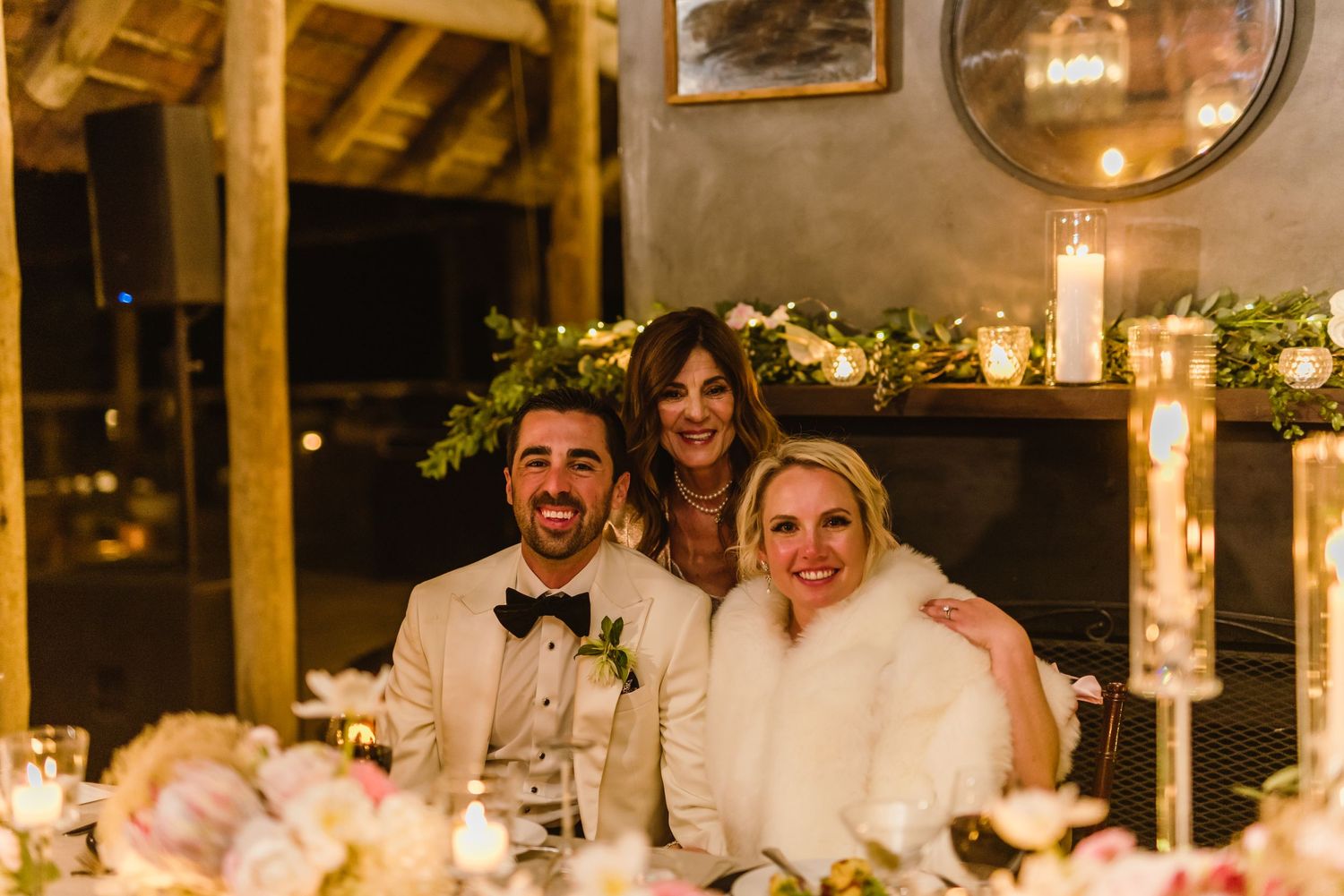 Elegant wedding reception venue with candlelit tables and warm lighting creating a romantic atmosphere.
