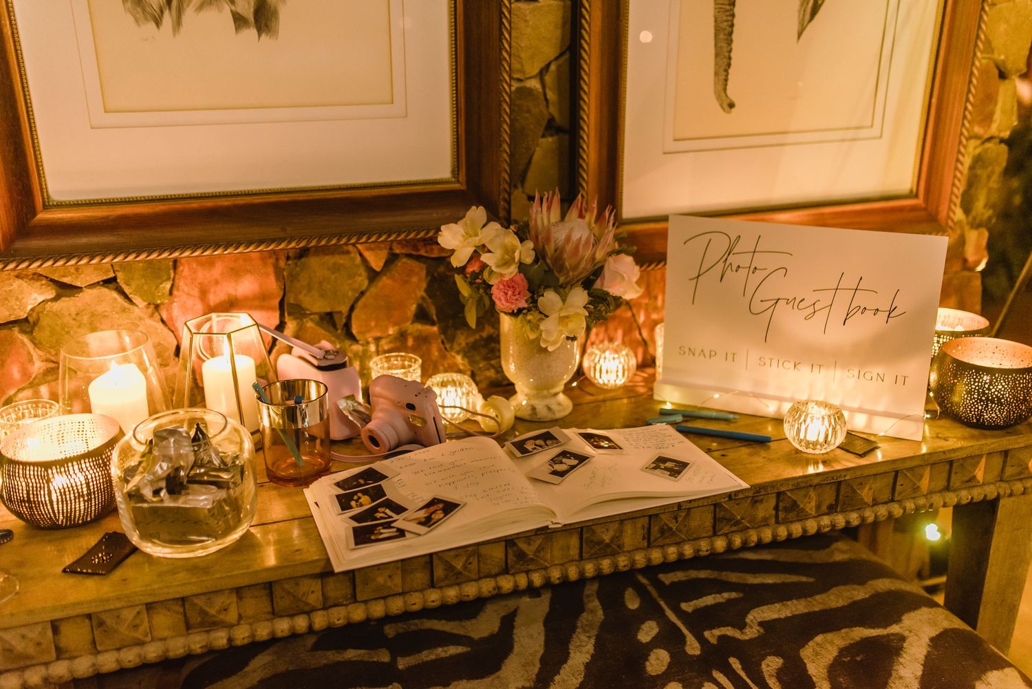 Wedding reception decor featuring framed table numbers and elegant place settings.