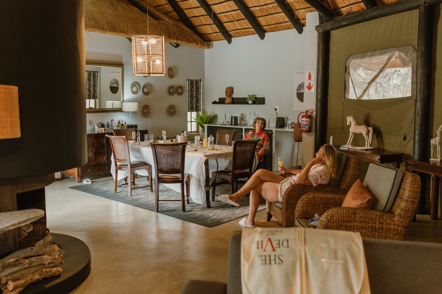 Spacious lodge interior with rustic wooden beams and comfortable seating areas.