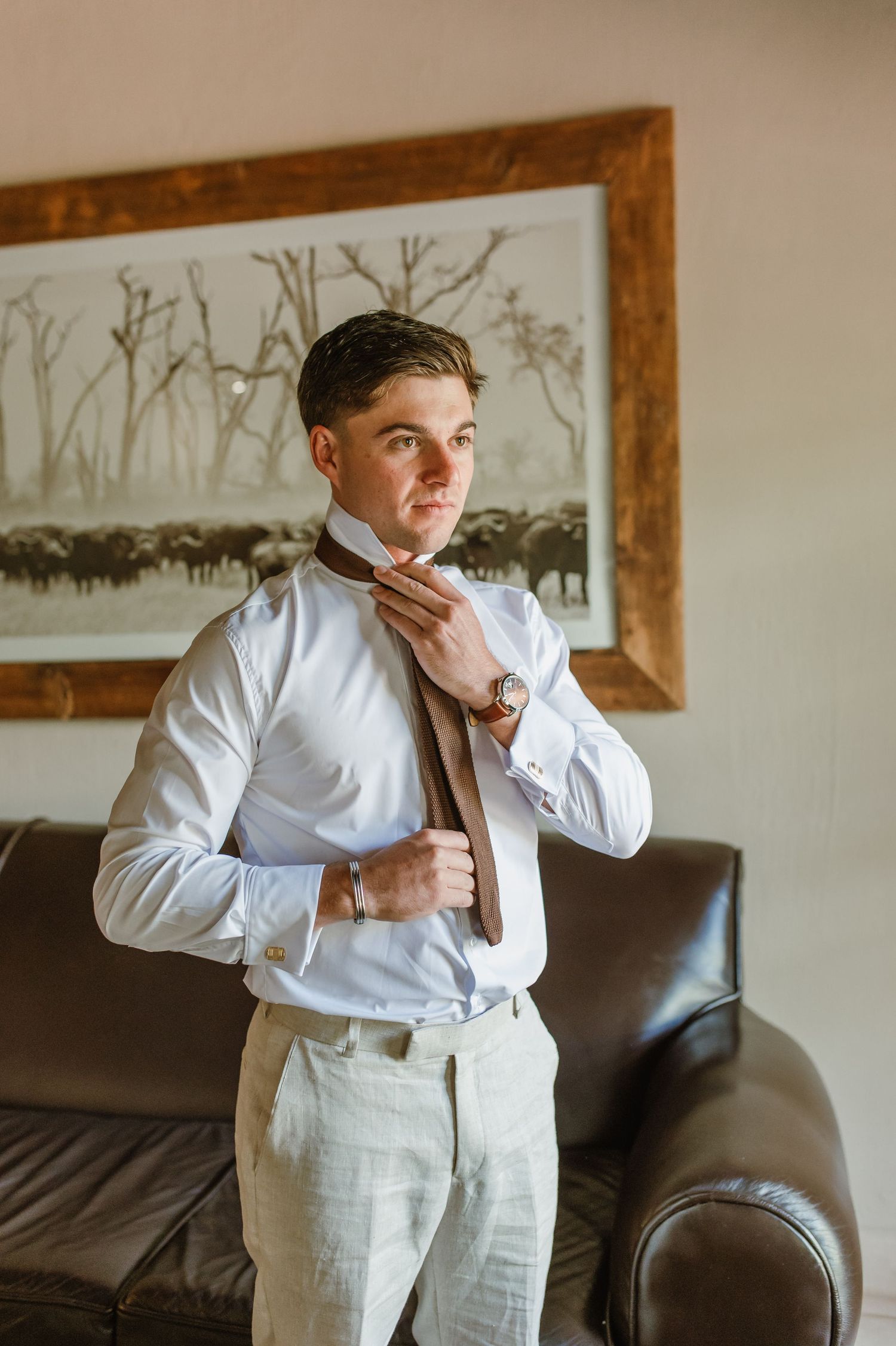 A series of photos showing formal attire preparation with white shirt and suspenders.
