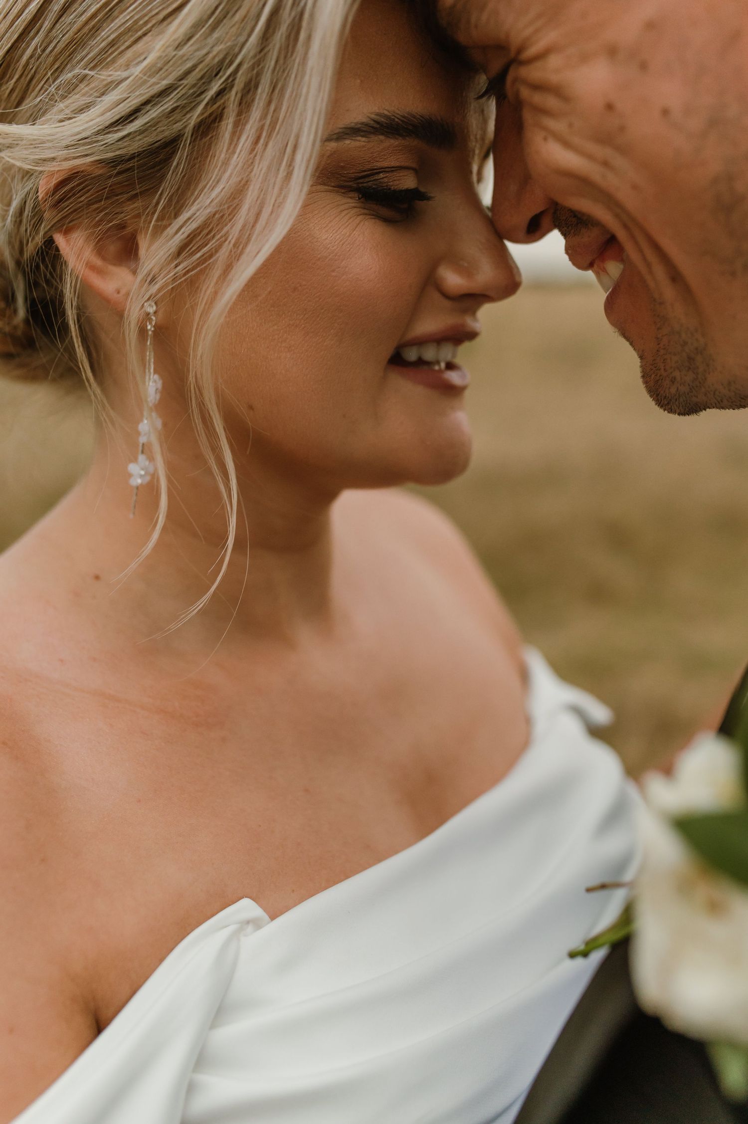 Close-up wedding photos showing tender moments between newlyweds.