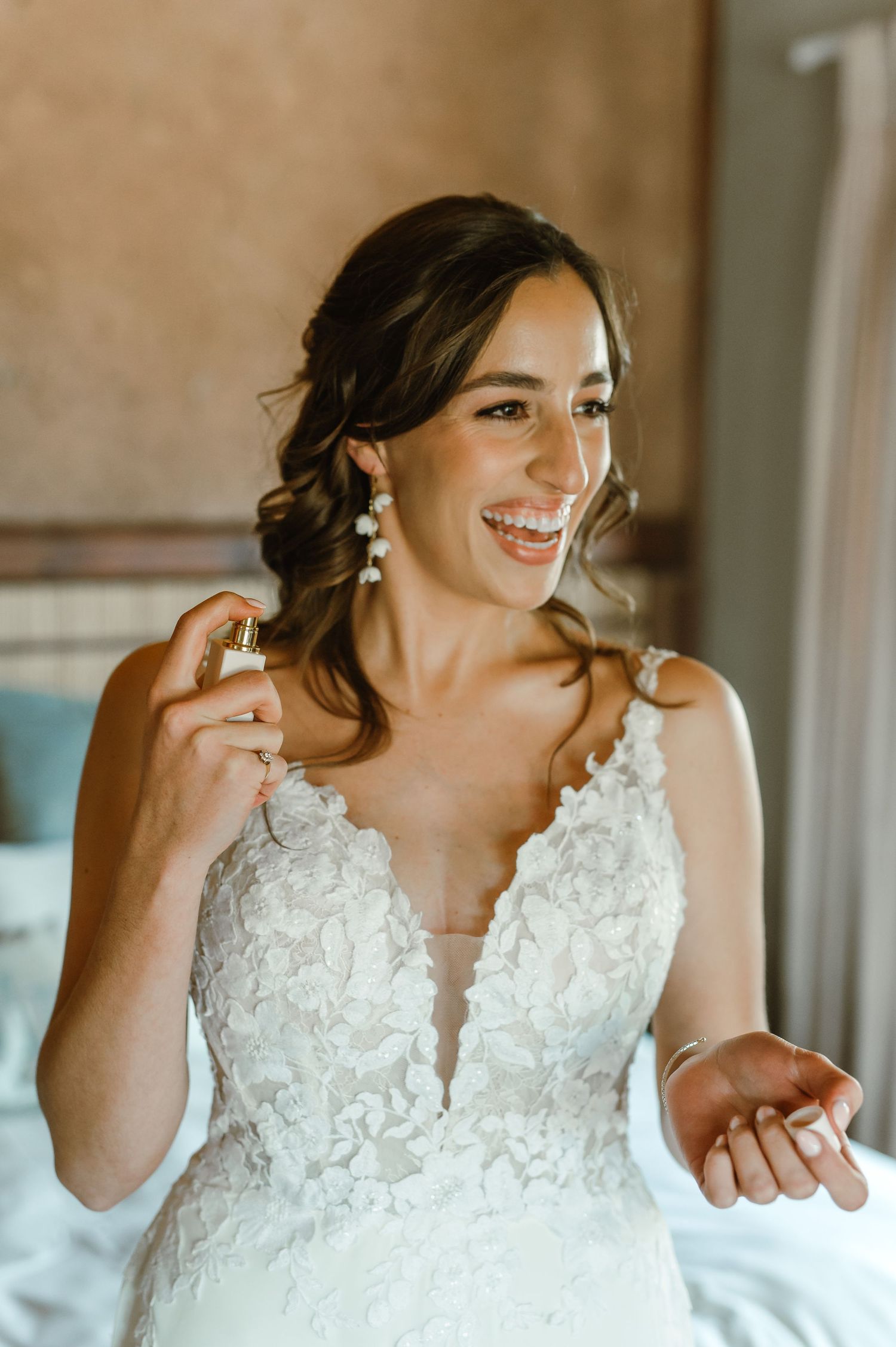 Close-up details of intricate lace bodice on a white wedding gown.