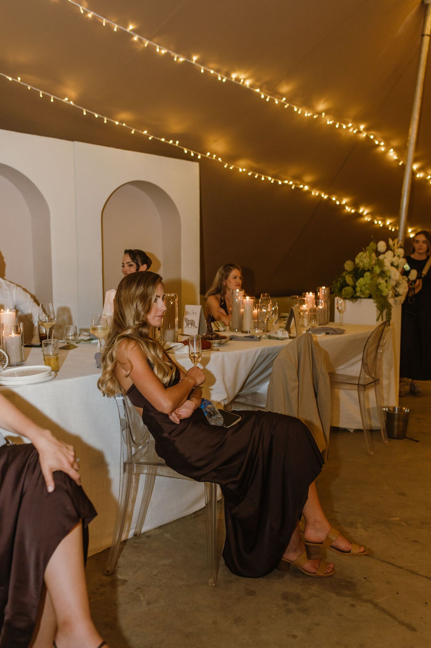 Elegant wedding reception dance floor with string lights creating a warm ambiance.