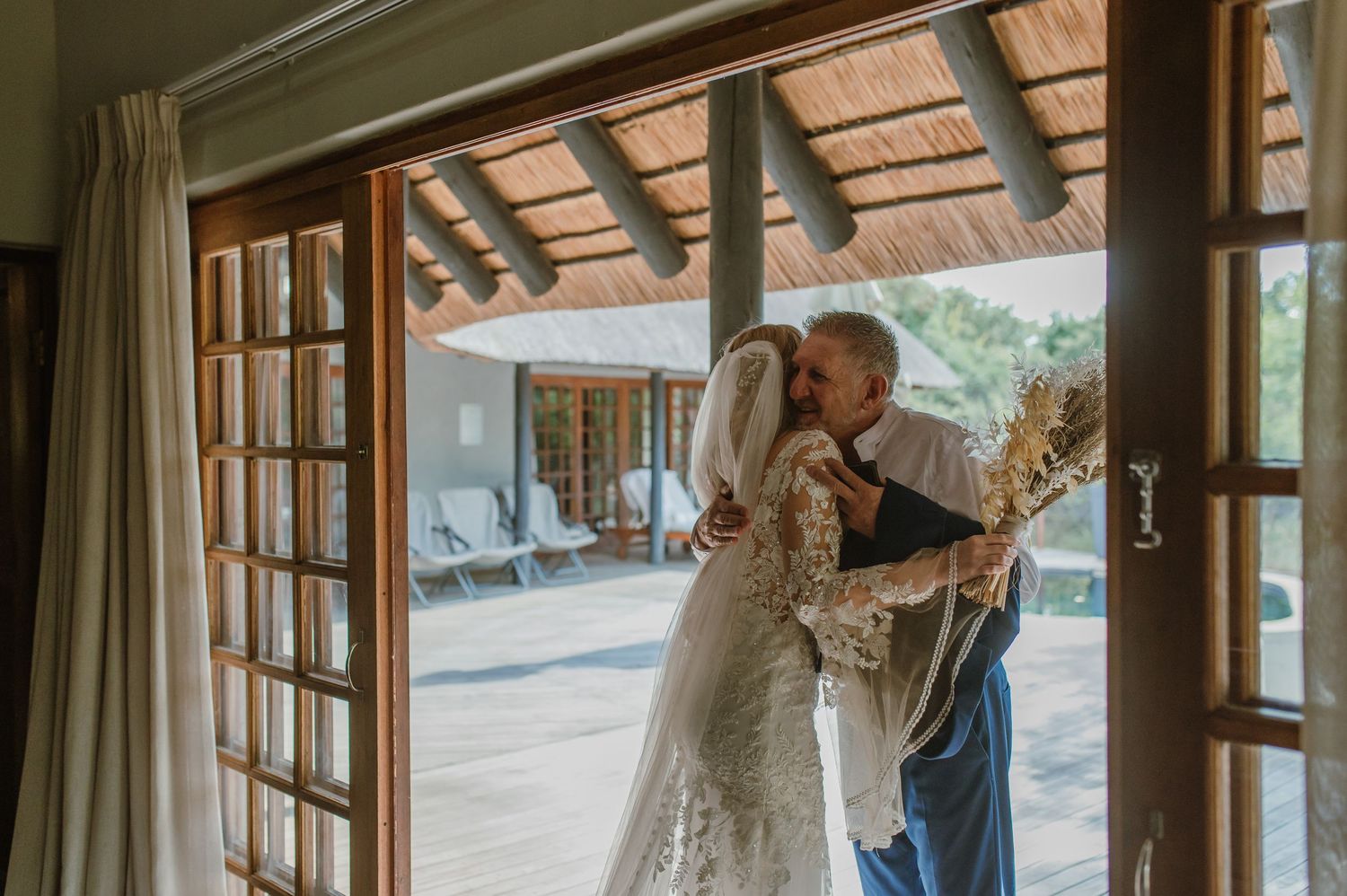 Wedding photography session in a rustic venue with natural window lighting.