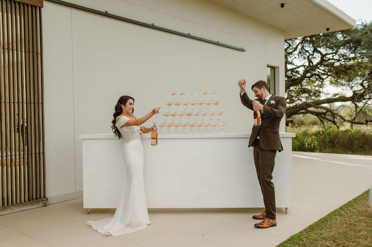 Modern wedding venue interior with wooden slat details and clean white walls.