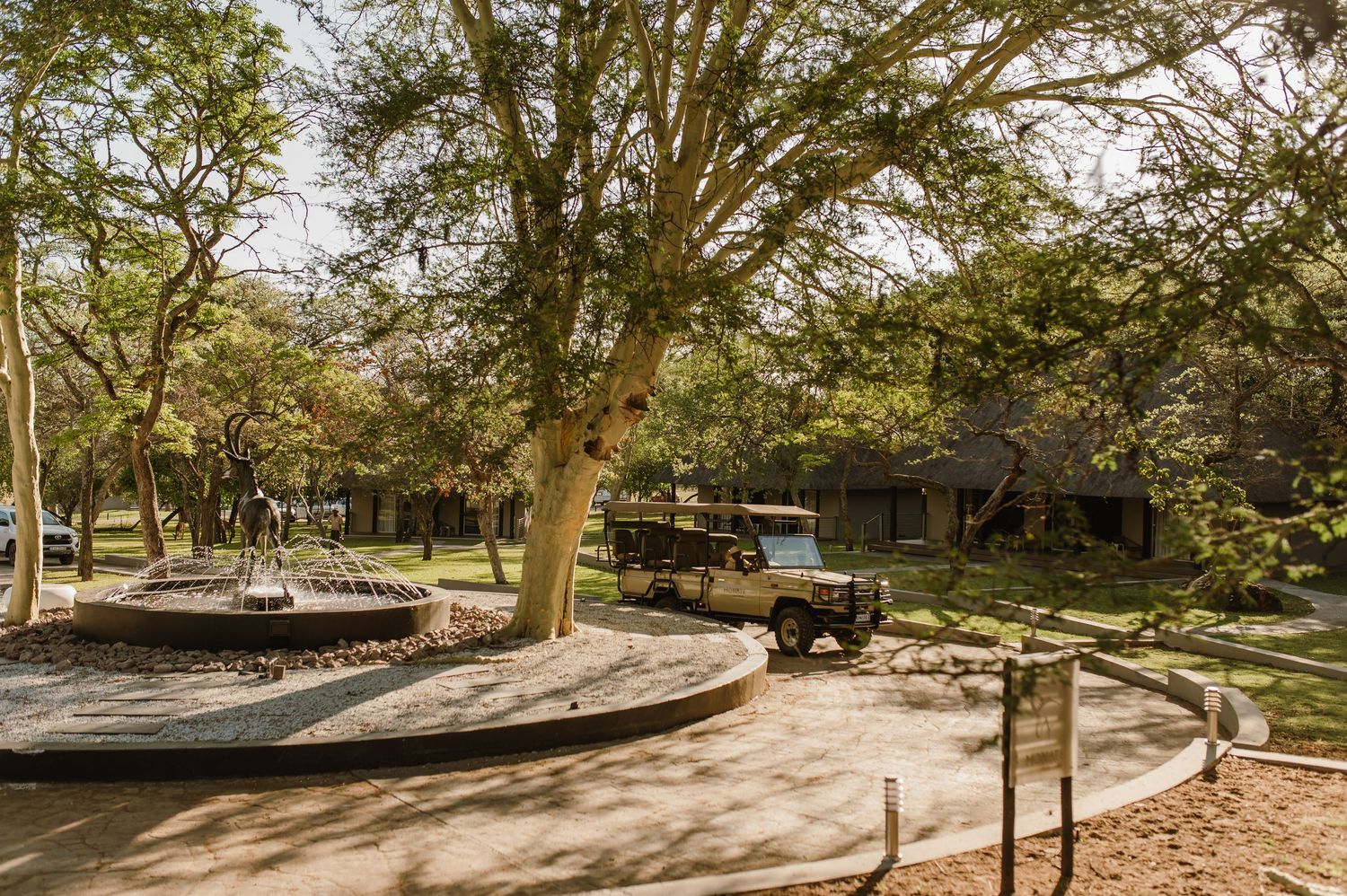 Panoramic landscape view of a safari lodge property with winding paths.