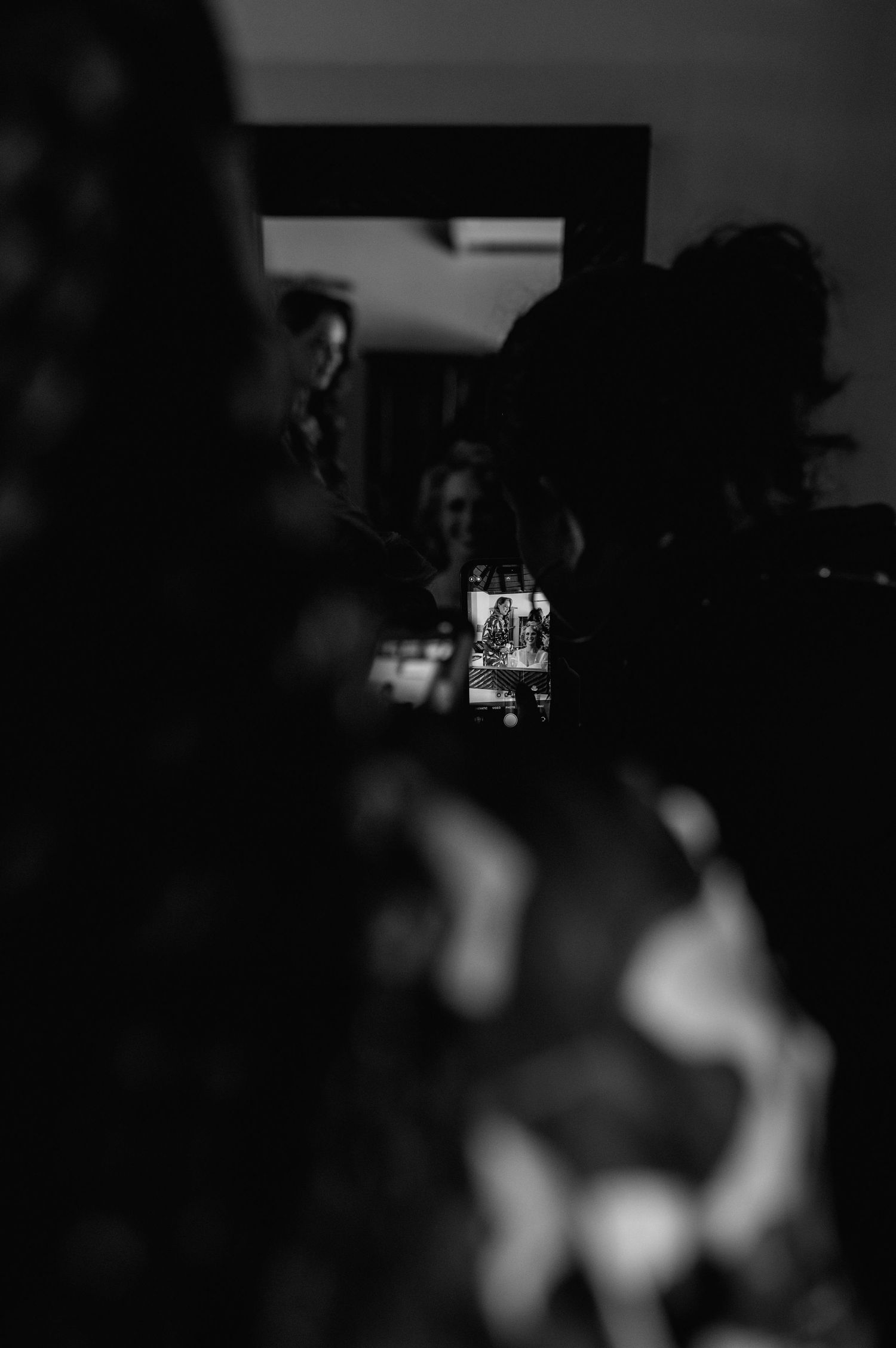 Dark artistic wedding photography sequence with blurred silhouettes.