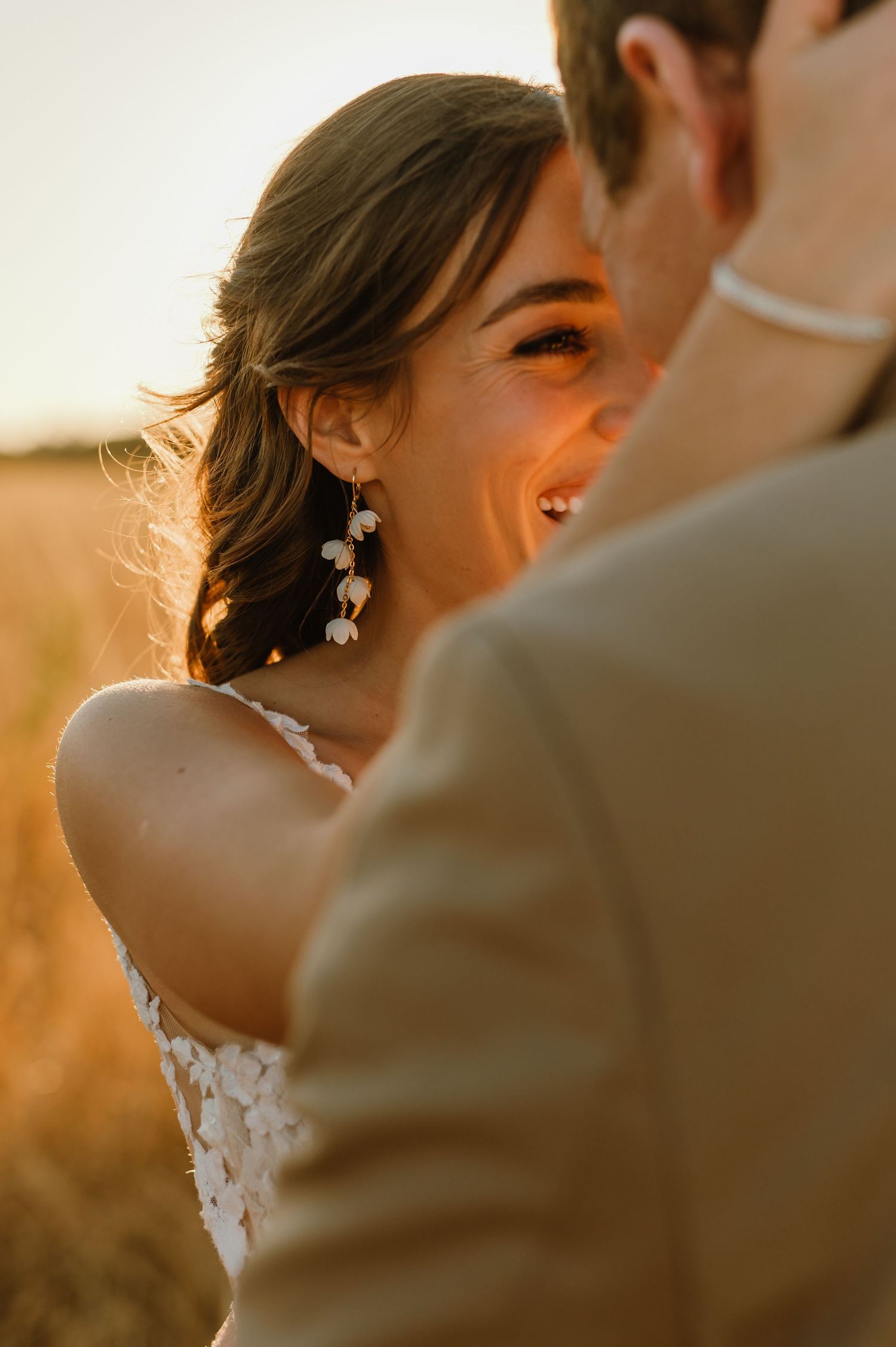 Close-up shot of a couple sharing an intimate moment during golden hour.
