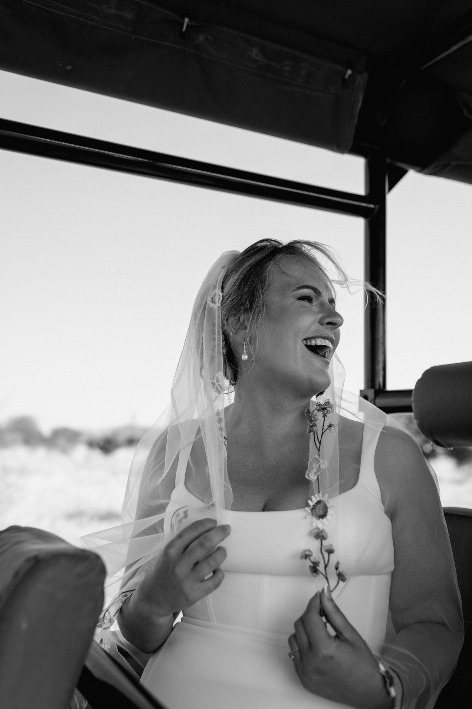 Candid black and white moments of joy captured inside a vehicle.
