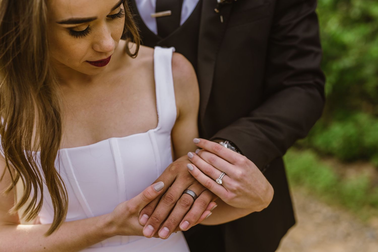 Intimate wedding portraits showing tender moments between newlyweds outdoors.