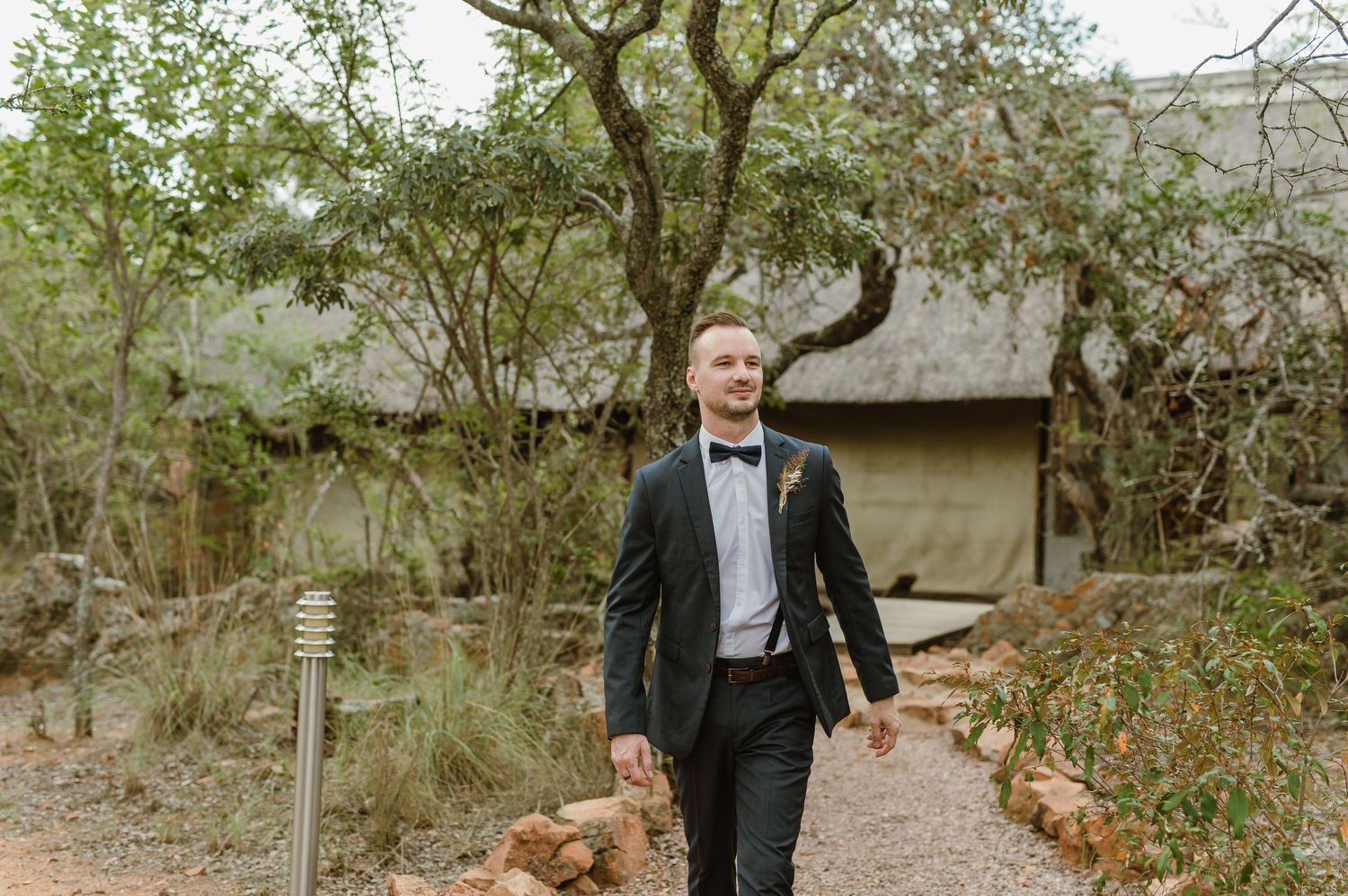 Someone walking along a path through natural woodland scenery.