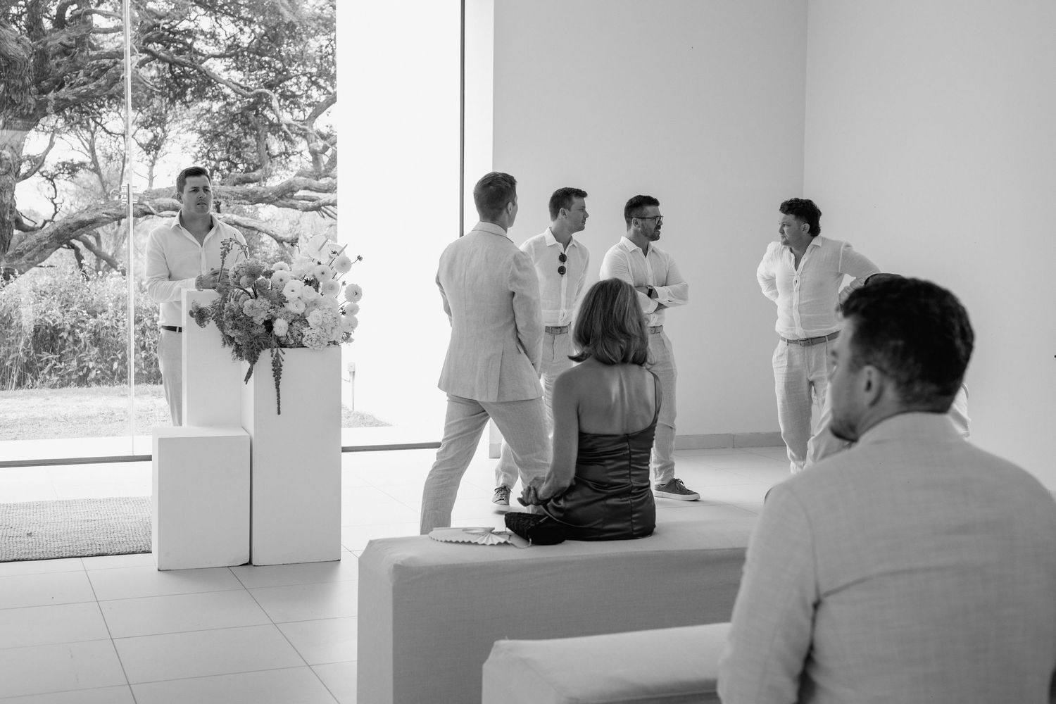 A black and white photo series showing students practicing martial arts in a traditional dojo setting.