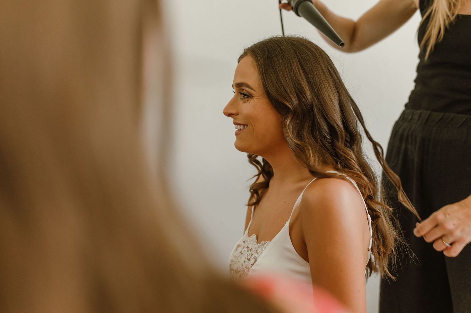 Wedding preparation moments captured in a bridal suite.
