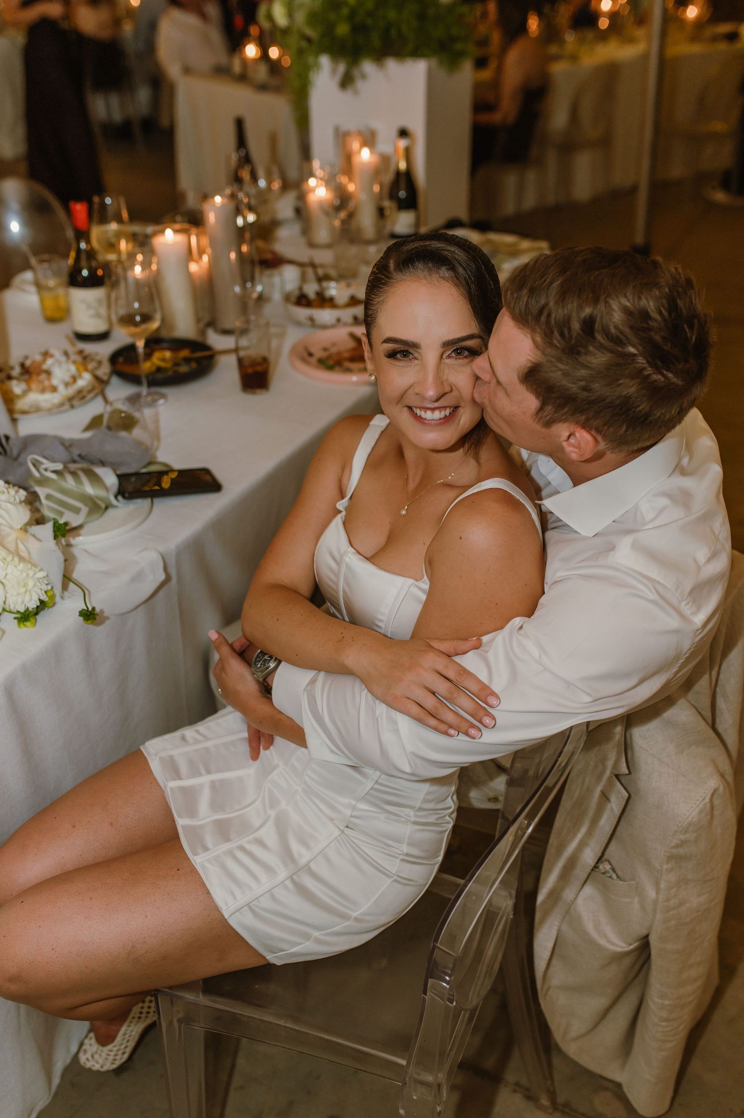Couple performing a romantic dip dance move at their wedding reception.