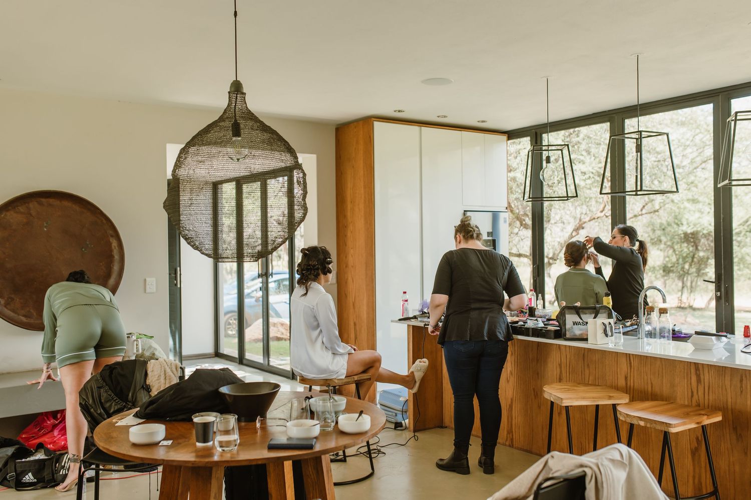 Modern interior of a spacious room with large windows and wooden accents.