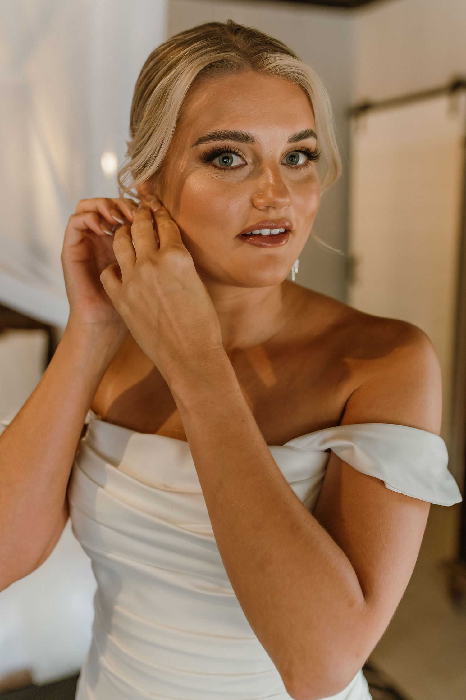 Candid sequence of bridal preparations showing emotional moments in white dress.