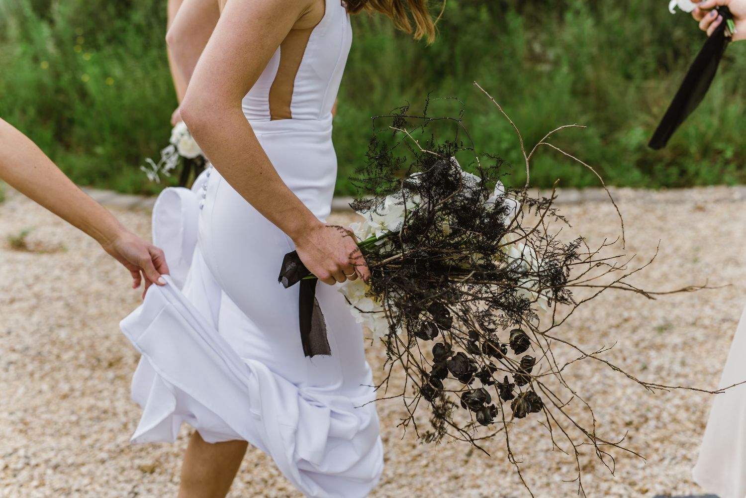 Wedding dress flowing in motion during outdoor bridal photoshoot.