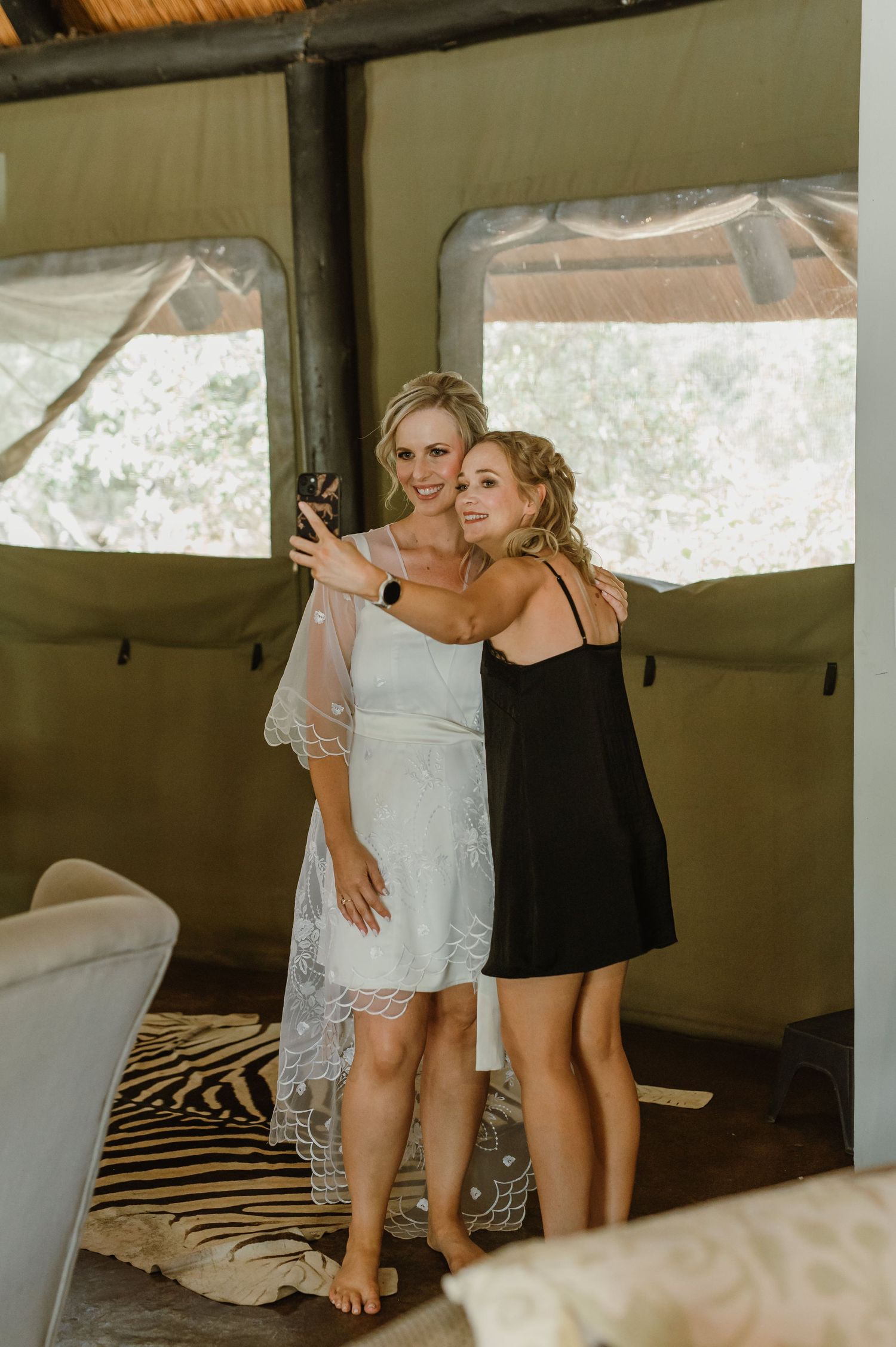 Wedding preparation moments captured in rustic indoor setting with natural light.