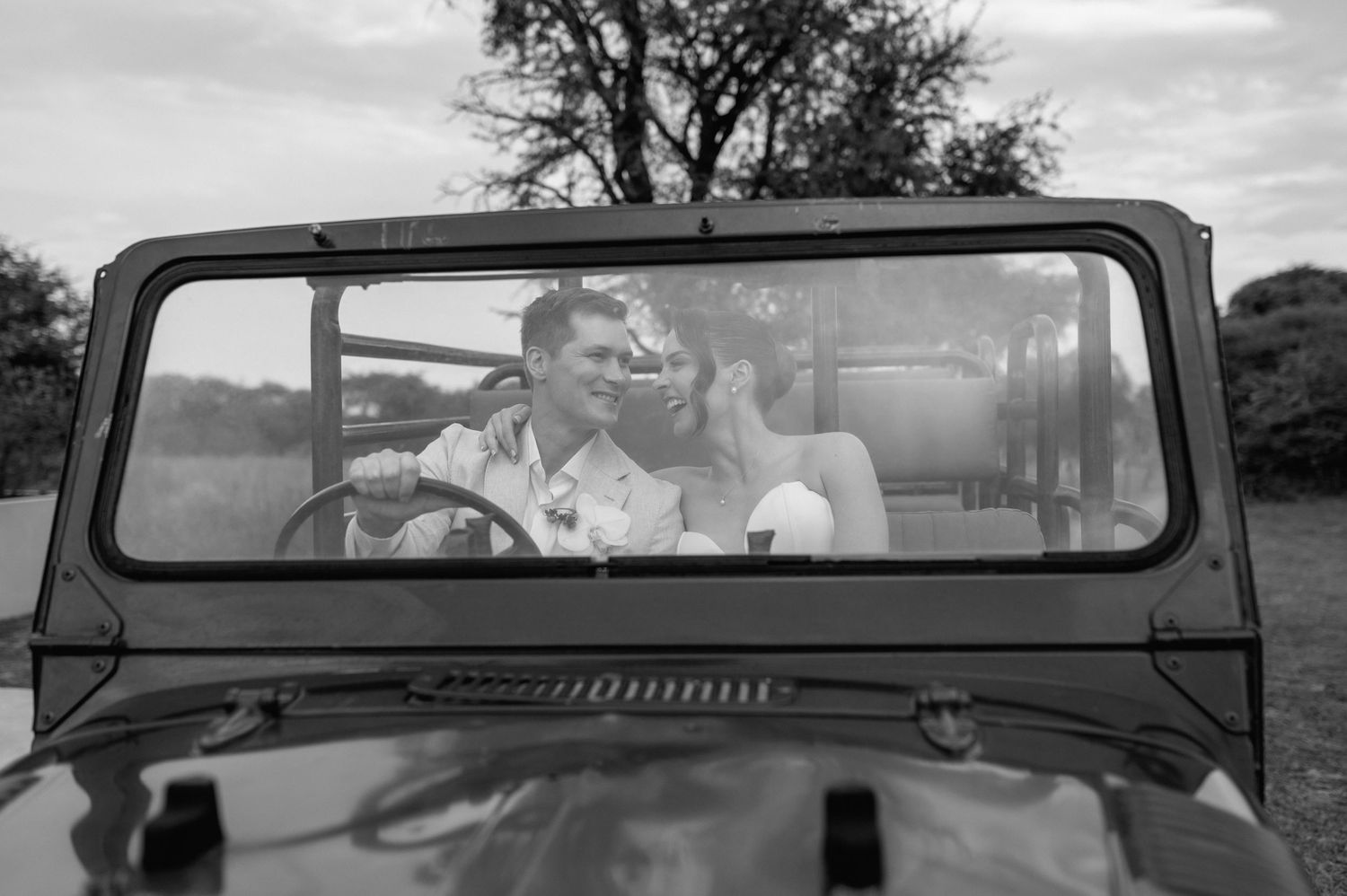 Black and white vintage photographs showing a car driving through a desert landscape with mountains in the background.