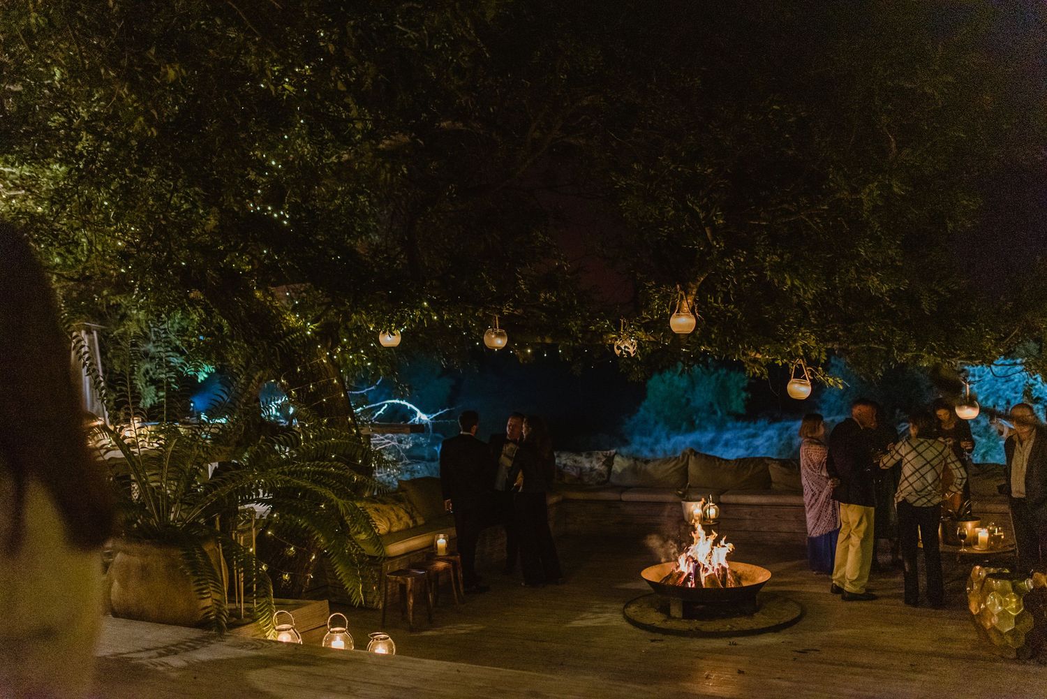 Outdoor event venue at night with string lights creating a magical ambiance.