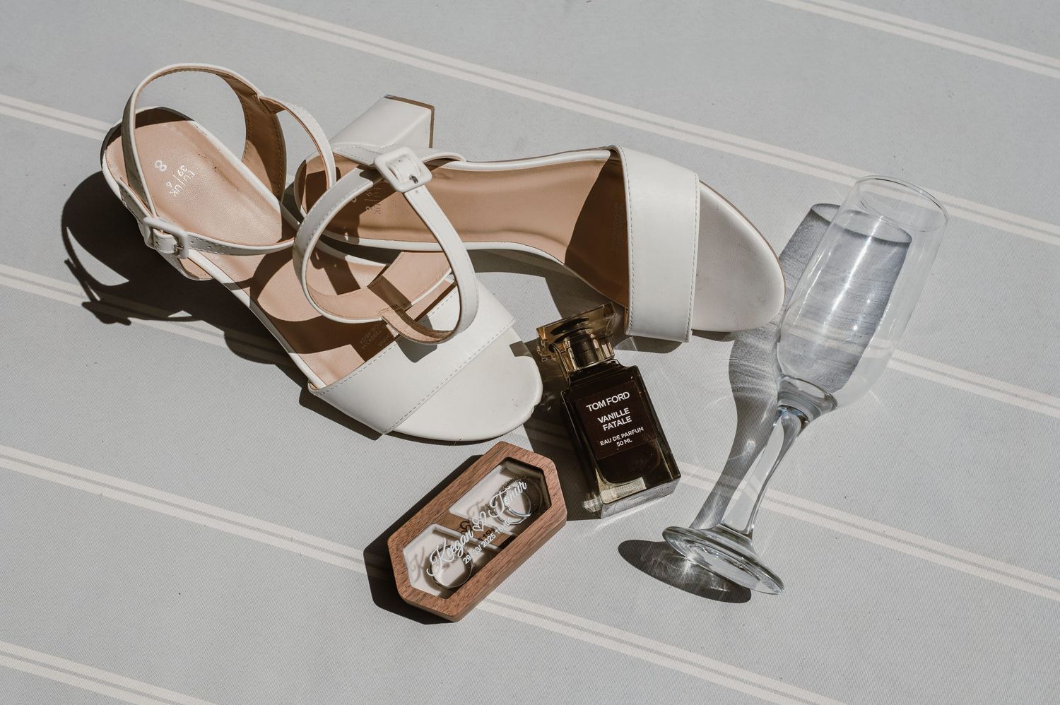 Wedding accessories including heels and jewelry arranged on a light surface.