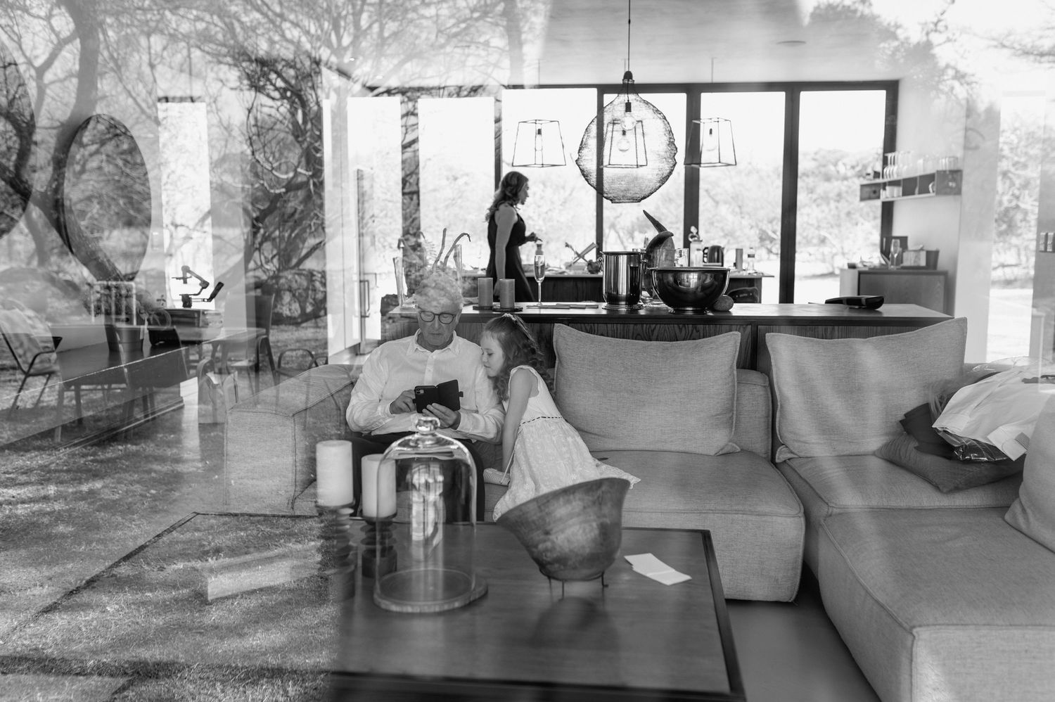 Black and white photos of modern wedding venue interior spaces.