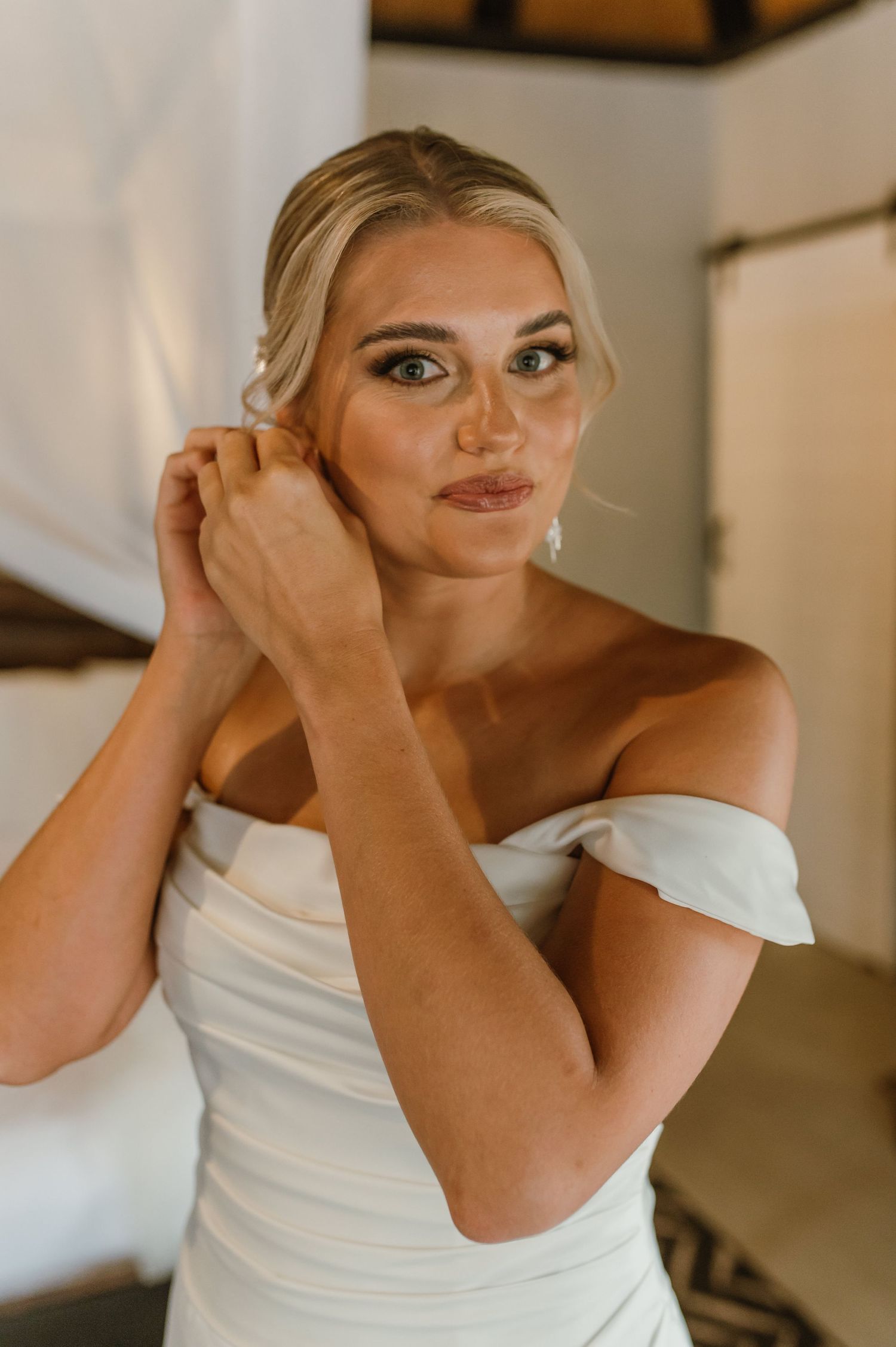 Getting ready sequence showing final touches of bridal preparation.