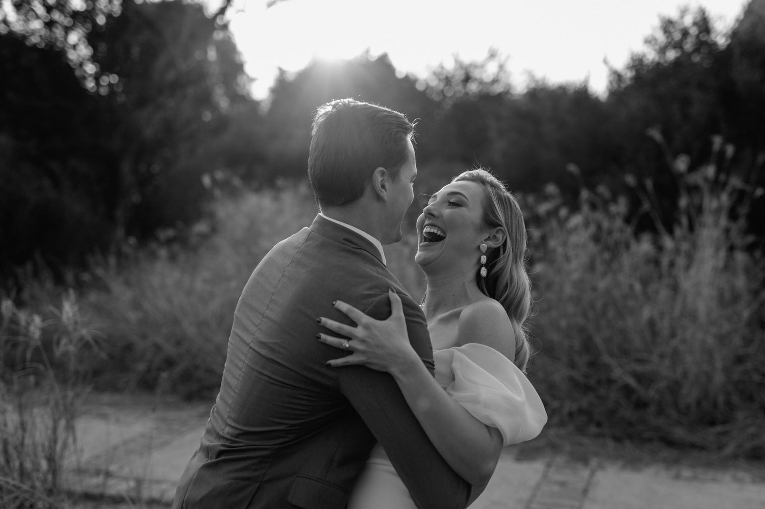 Black and white romantic portrait session in a natural outdoor setting.