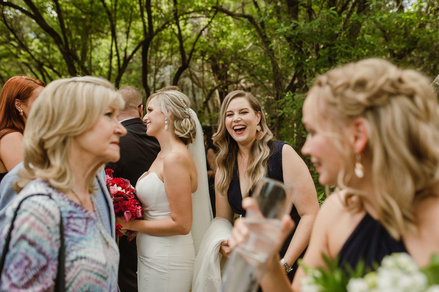 Joyful wedding celebration moments captured in a series of candid shots on a forest path.