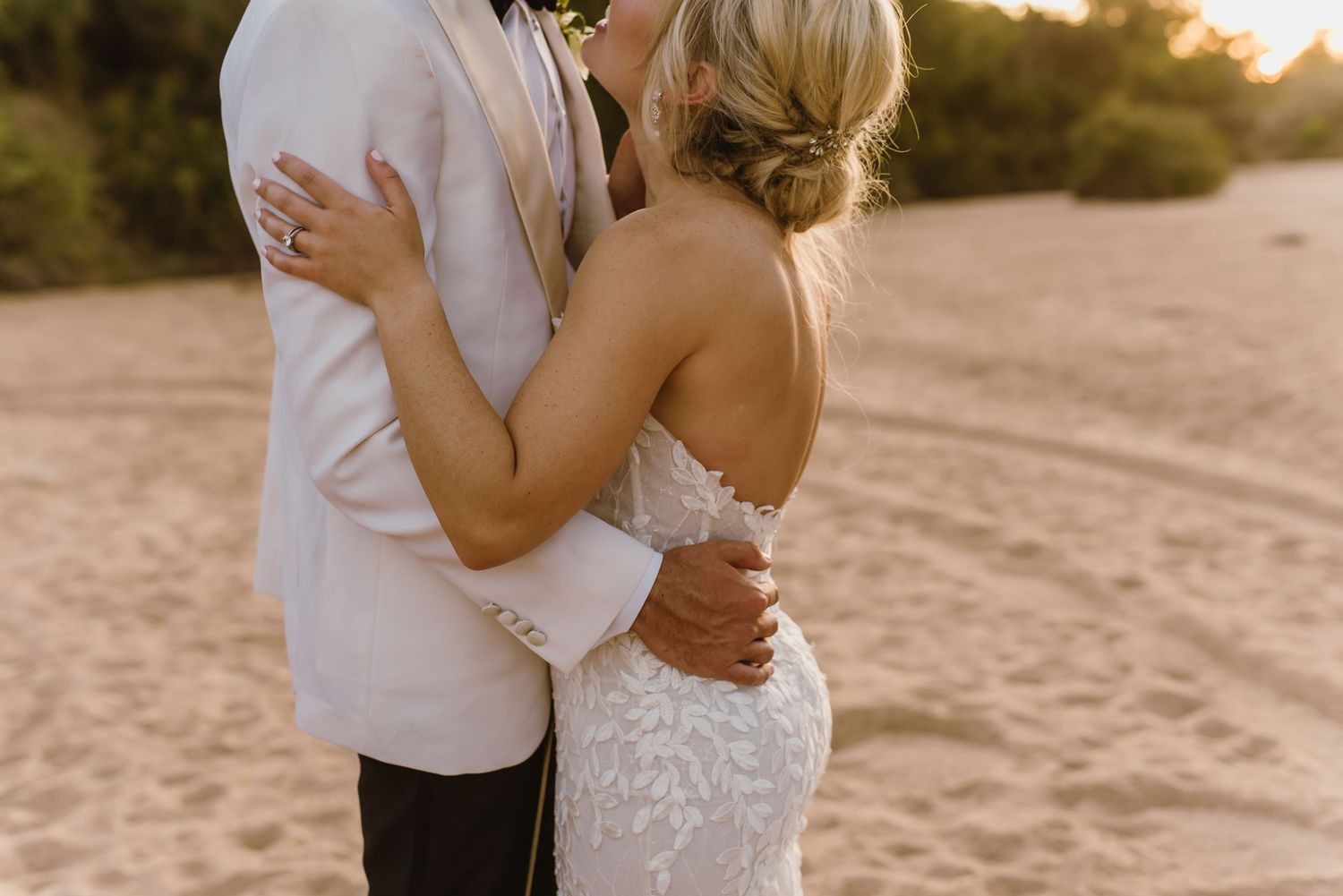 Romantic beach wedding photography session during golden hour.