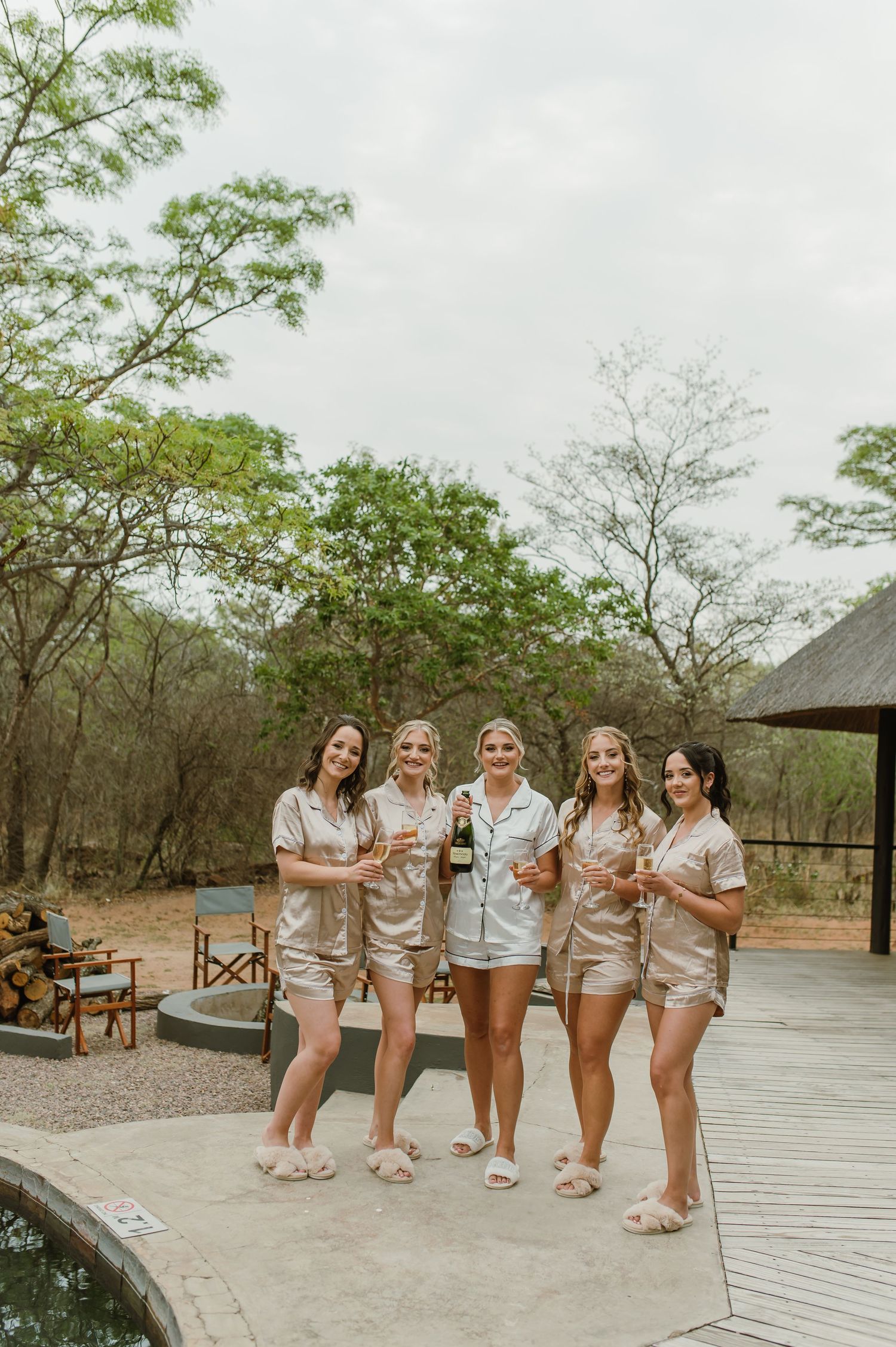 Group photo sequence on wooden deck with matching outfits in natural setting.