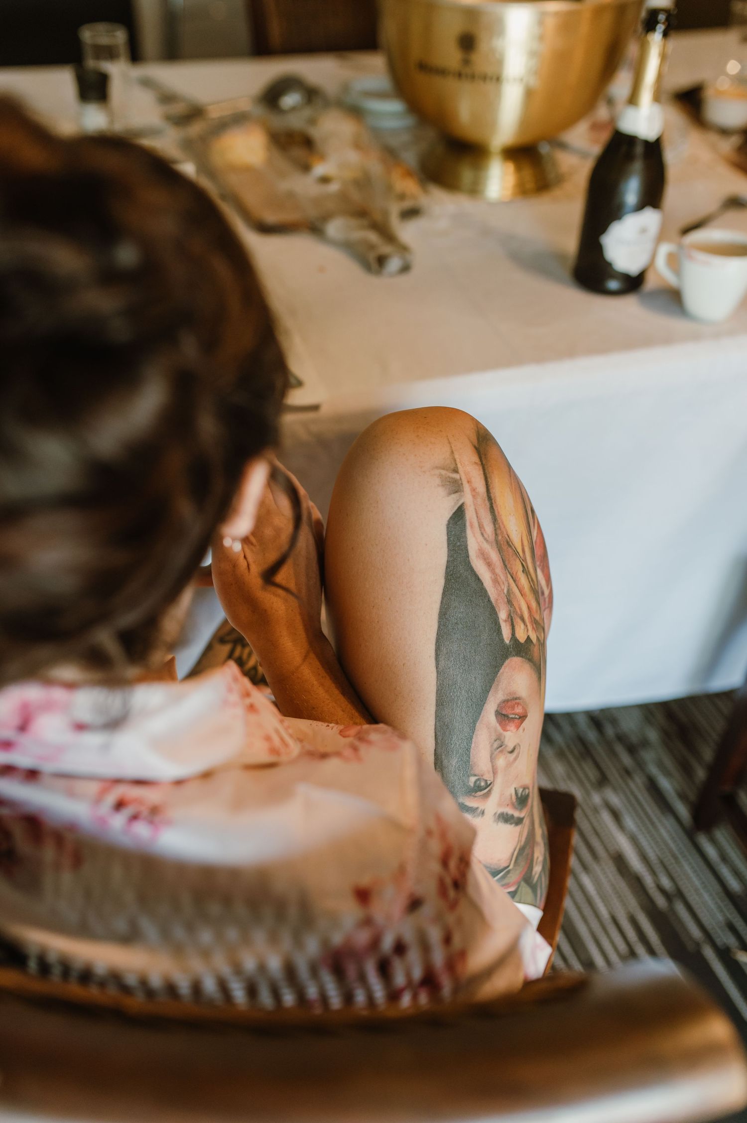 Close-up of artistic tattoos on skin against white background.