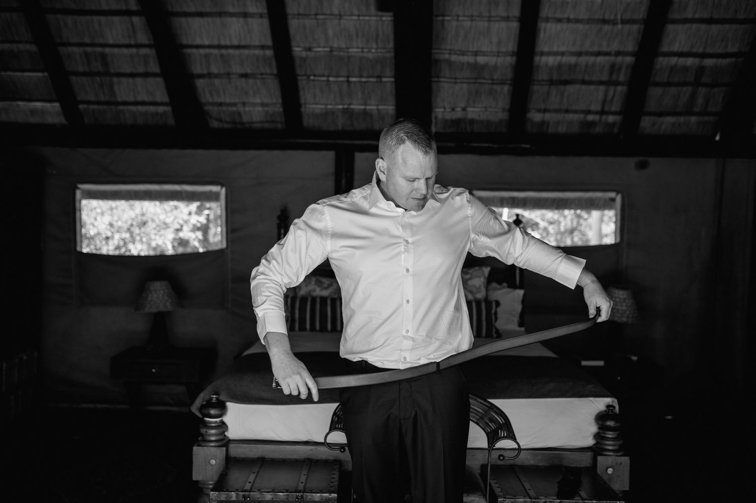 Sequence showing relaxed poses in rustic room with thatched ceiling.